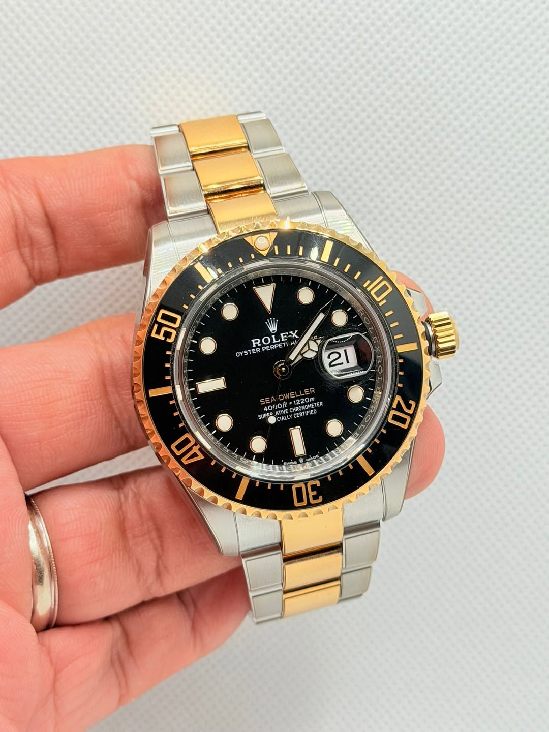 May be an image of wrist watch and text