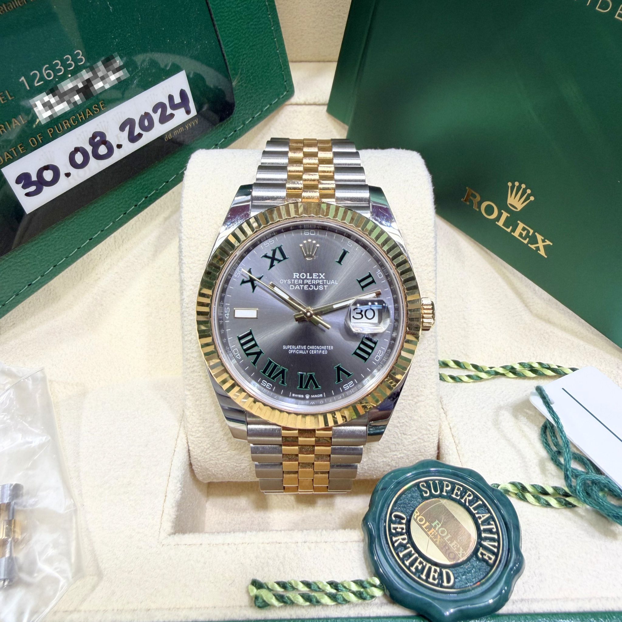 May be an image of wrist watch and text