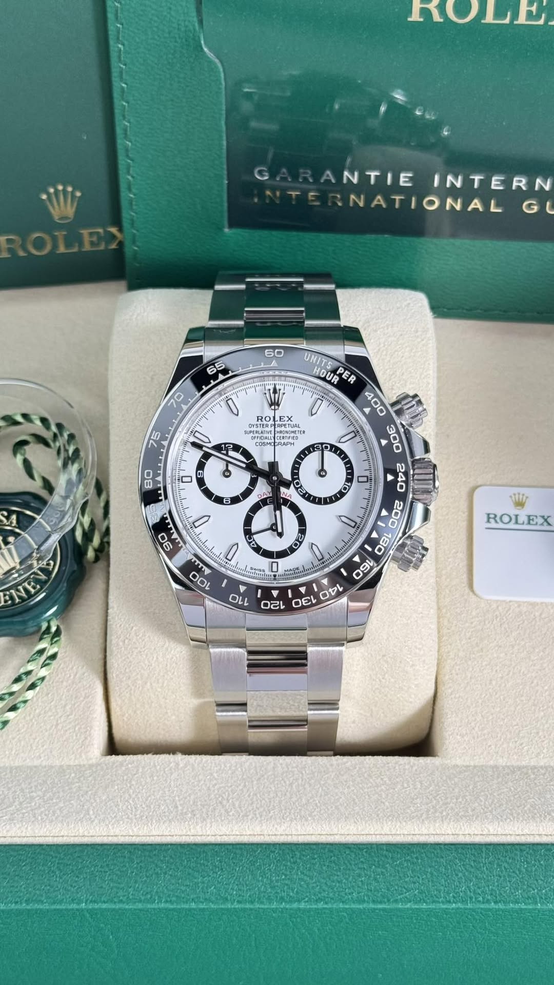May be an image of wrist watch and text that says 'oW ANTIEINTERN ANTIE INTERN NATIONAL G RO LEX SUPER-NAT RNNLE T WONGALIDK で o U 80 CAU LA 21 店 U 90 ت - O 100 0O. ت UNITS HOUR…
