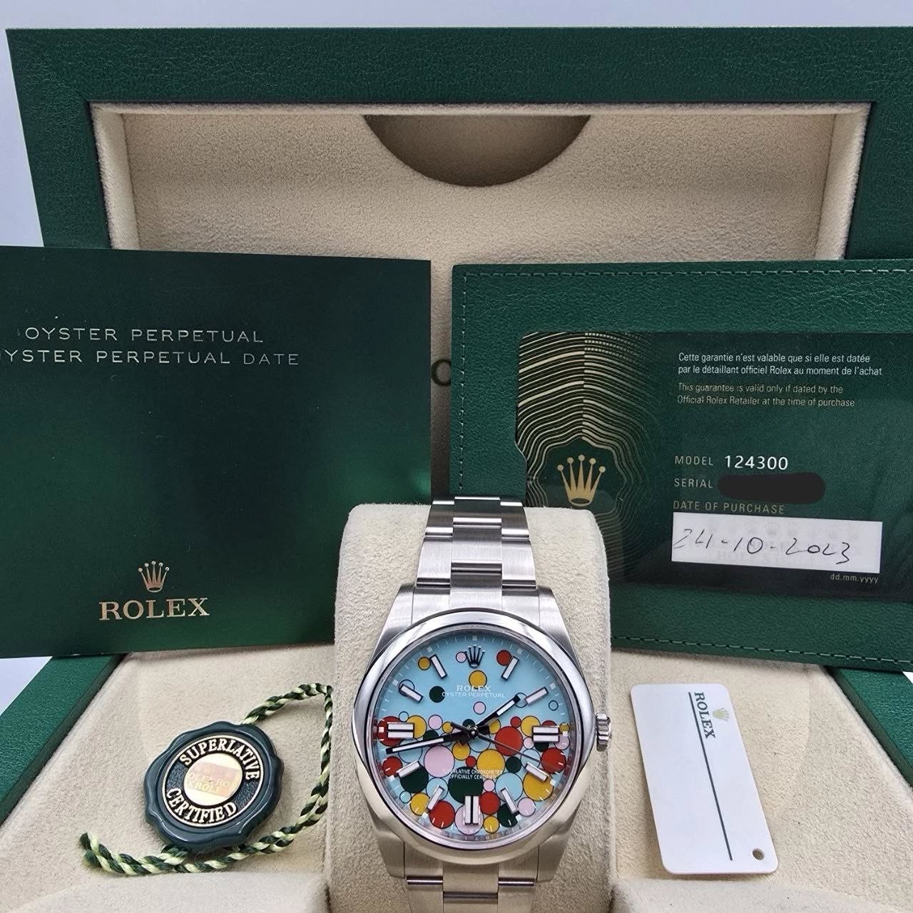 May be an image of wrist watch and text that says 'OYSTER PERPE OYSTERPERPETUAL TUAL YSTER PERPE STERPERPETUALD/ TUALDAT TUAL PERPETUAL Campramiesi.aokese LttesfReltPee.o…