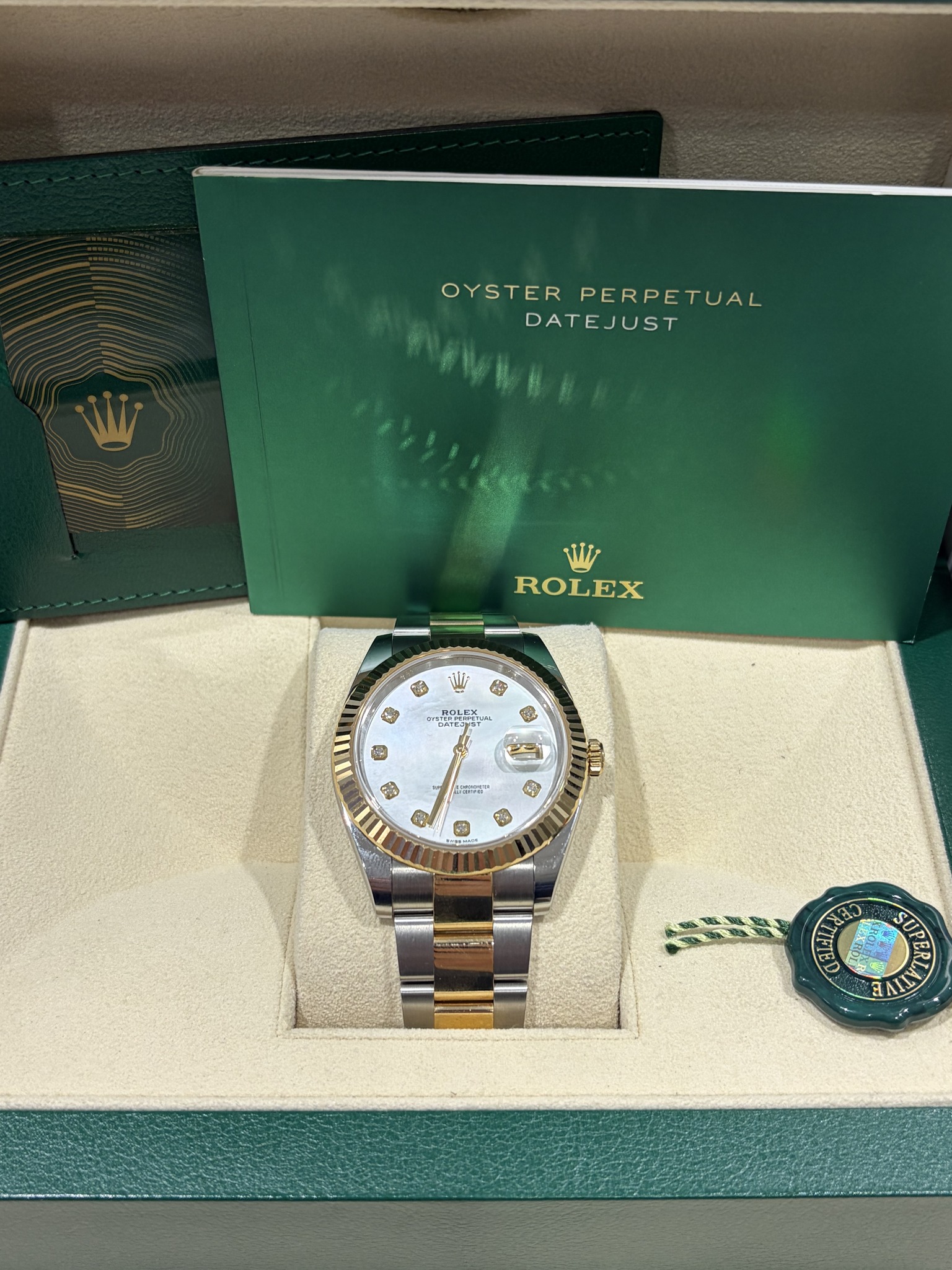 May be an image of wrist watch and text