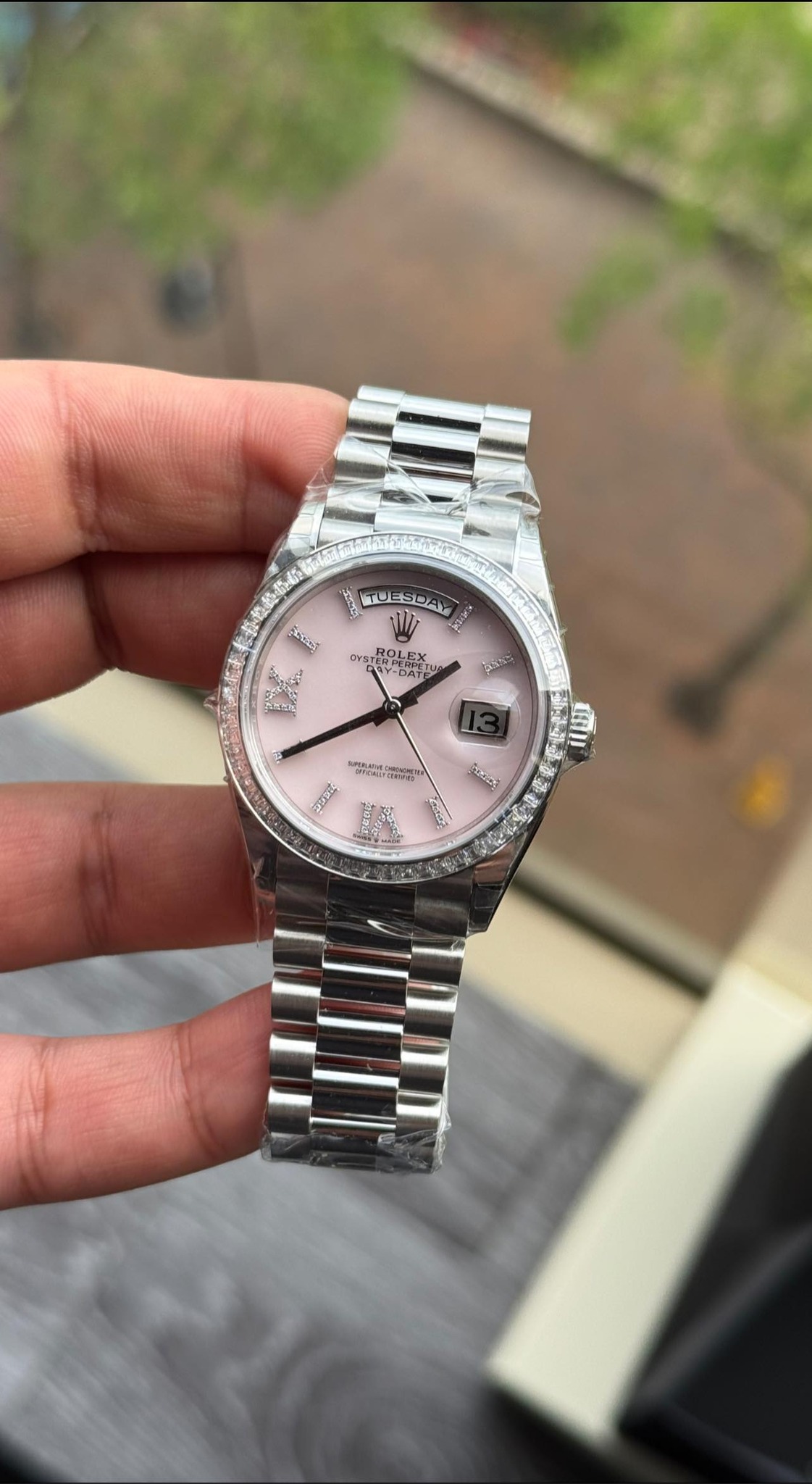 May be an image of wrist watch and text