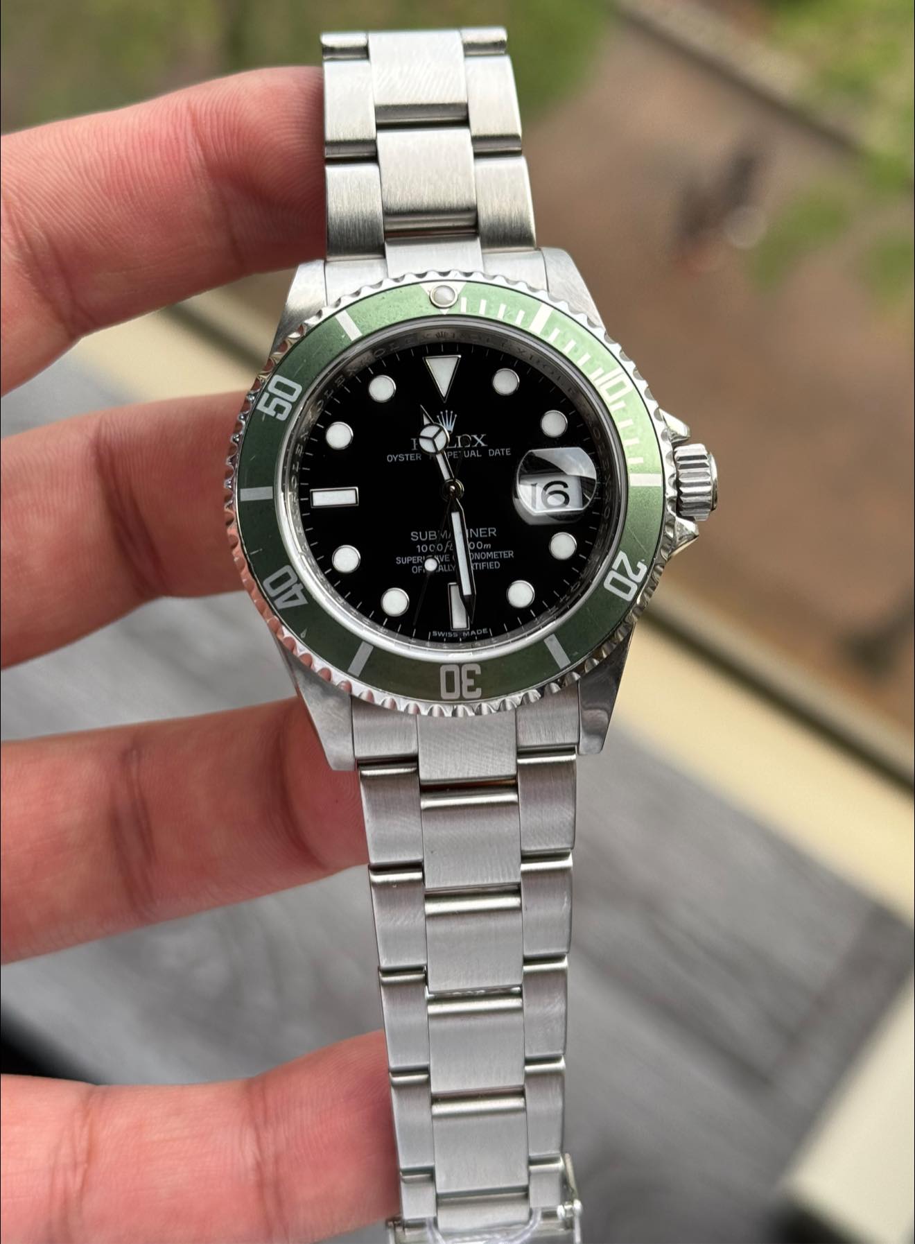 May be an image of wrist watch and text