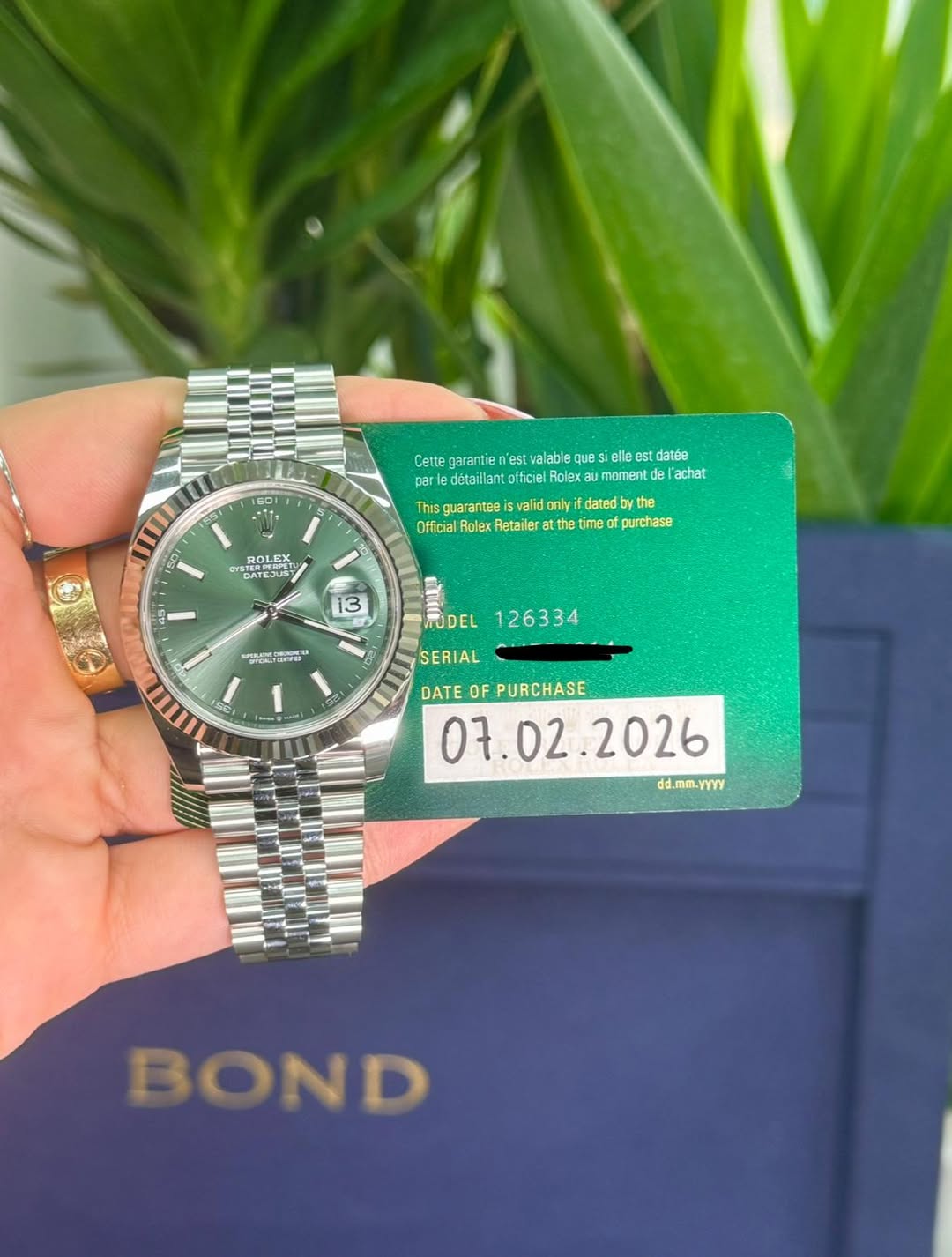 May be an image of wrist watch and text