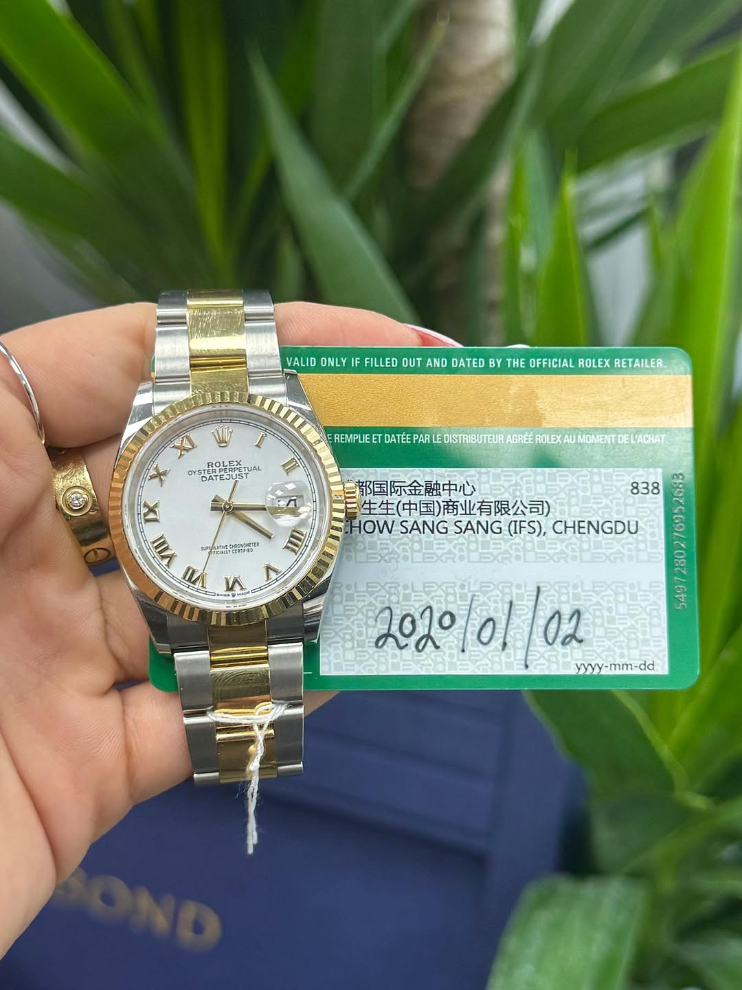 May be an image of wrist watch and text that says 'VALID ONLY IF FILLED OUT AND DATED BY THE OFFICIAL ROLEX RETAILER. OYSTERPC DATEJUST ERPER ROLEX TUAL T IX VIII VII V ॥ REMPLIE…