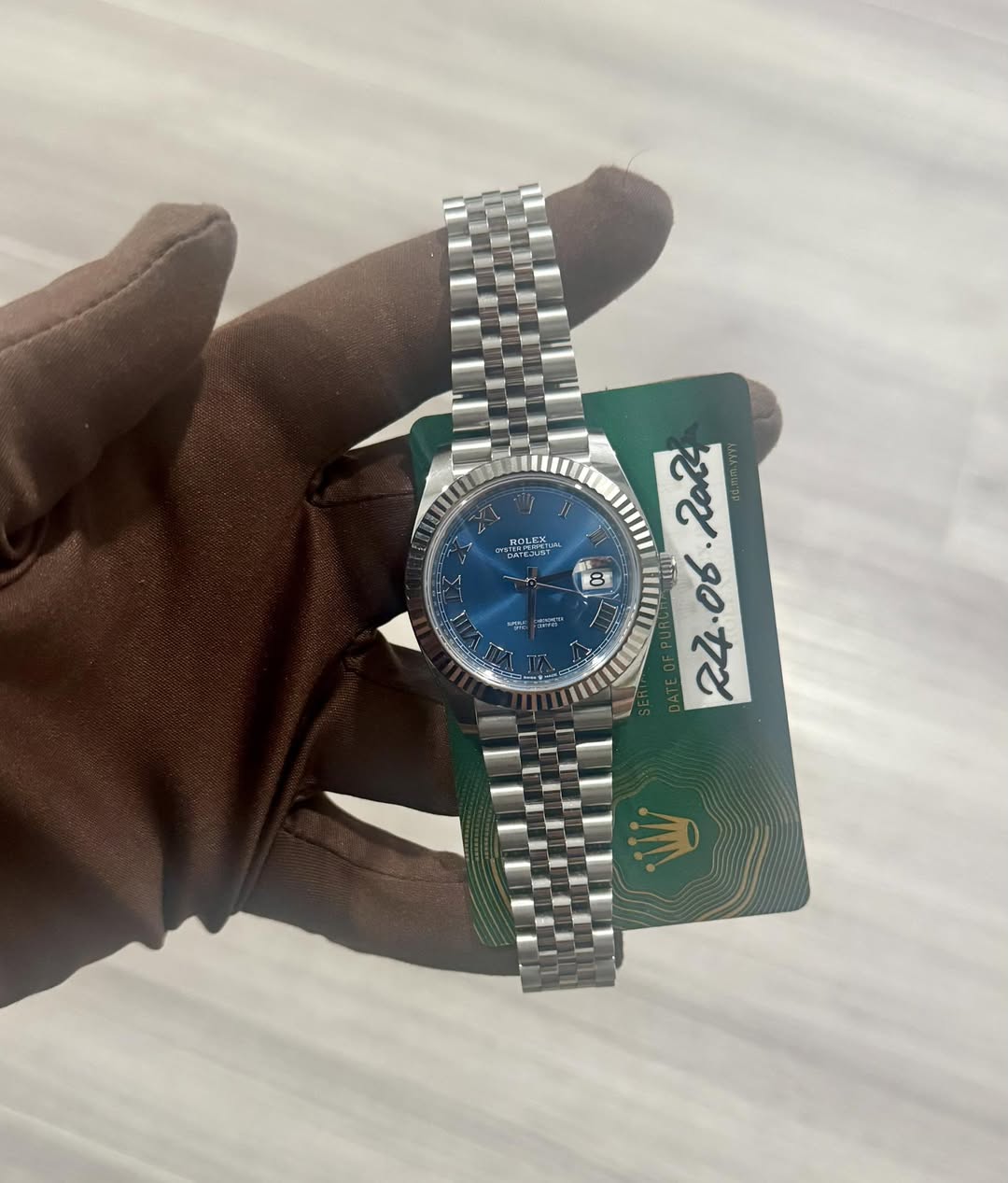 May be an image of wrist watch and text
