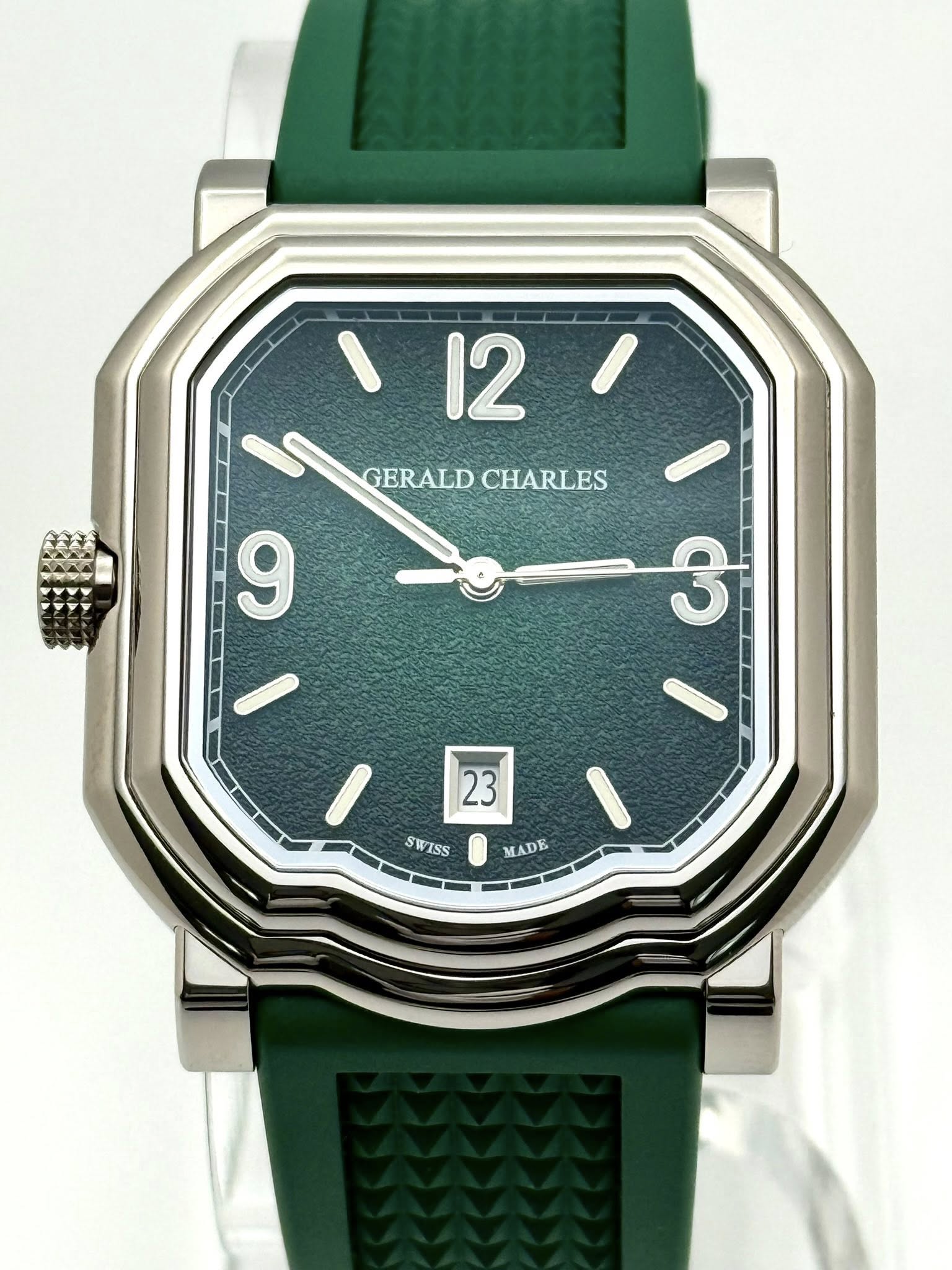 May be an image of digital watch and text that says '12/ ١ 12 GERALDCHARLES GERALD CHARLES 9 ص 23 SWISS S ISS MADE'