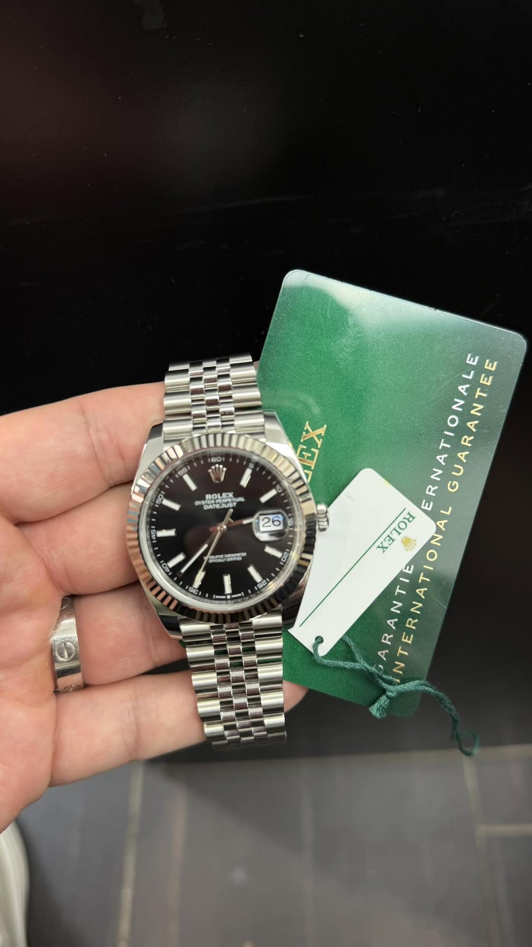 May be an image of wrist watch and text