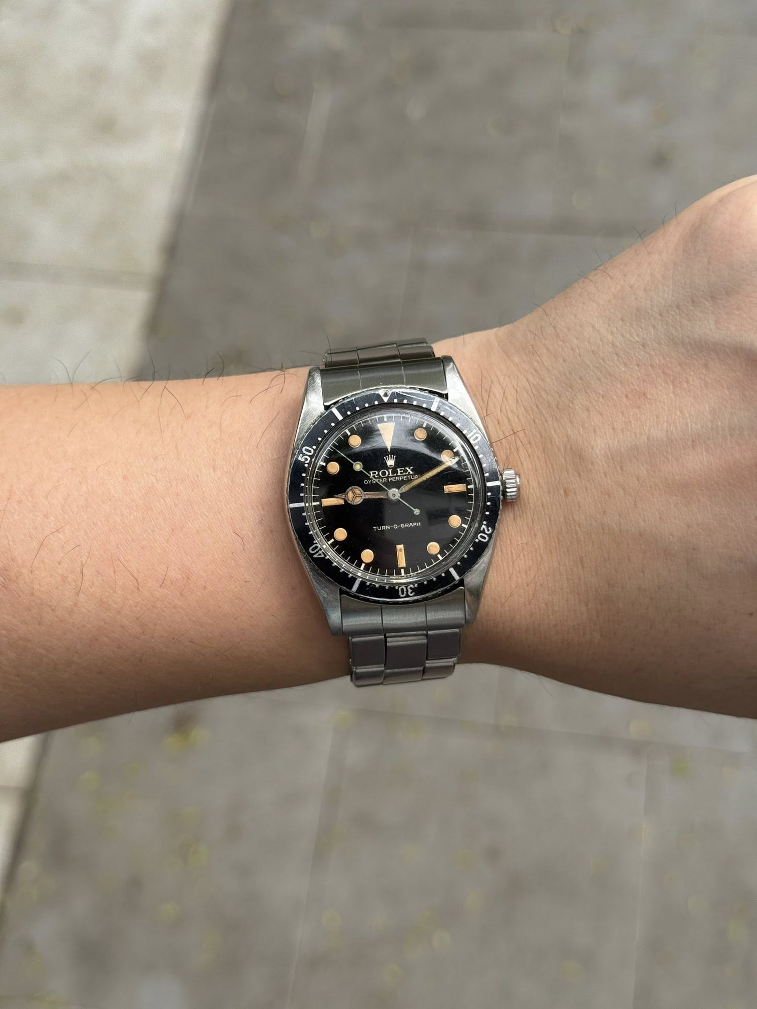 May be an image of wrist watch and text