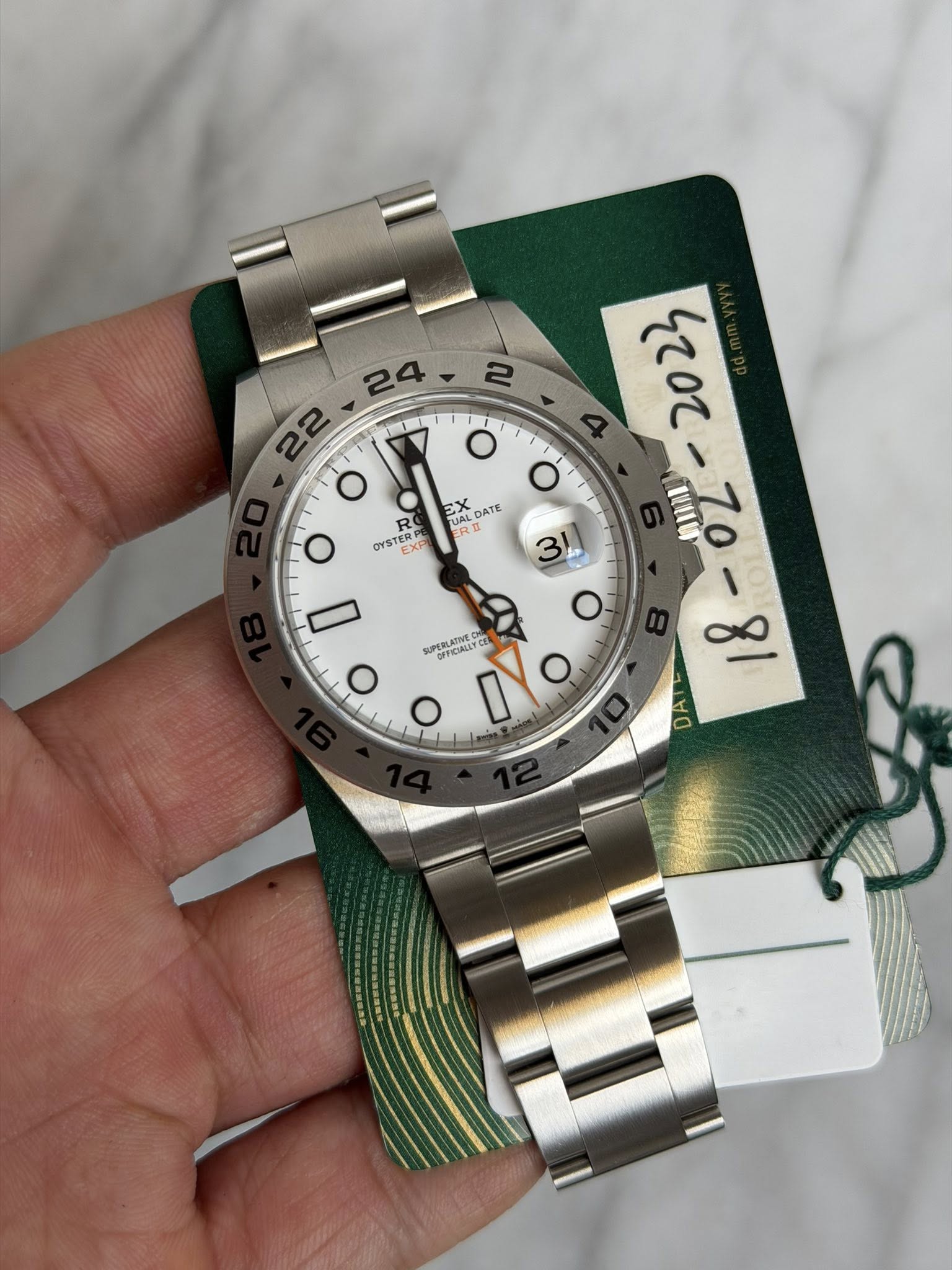 May be an image of wrist watch and text
