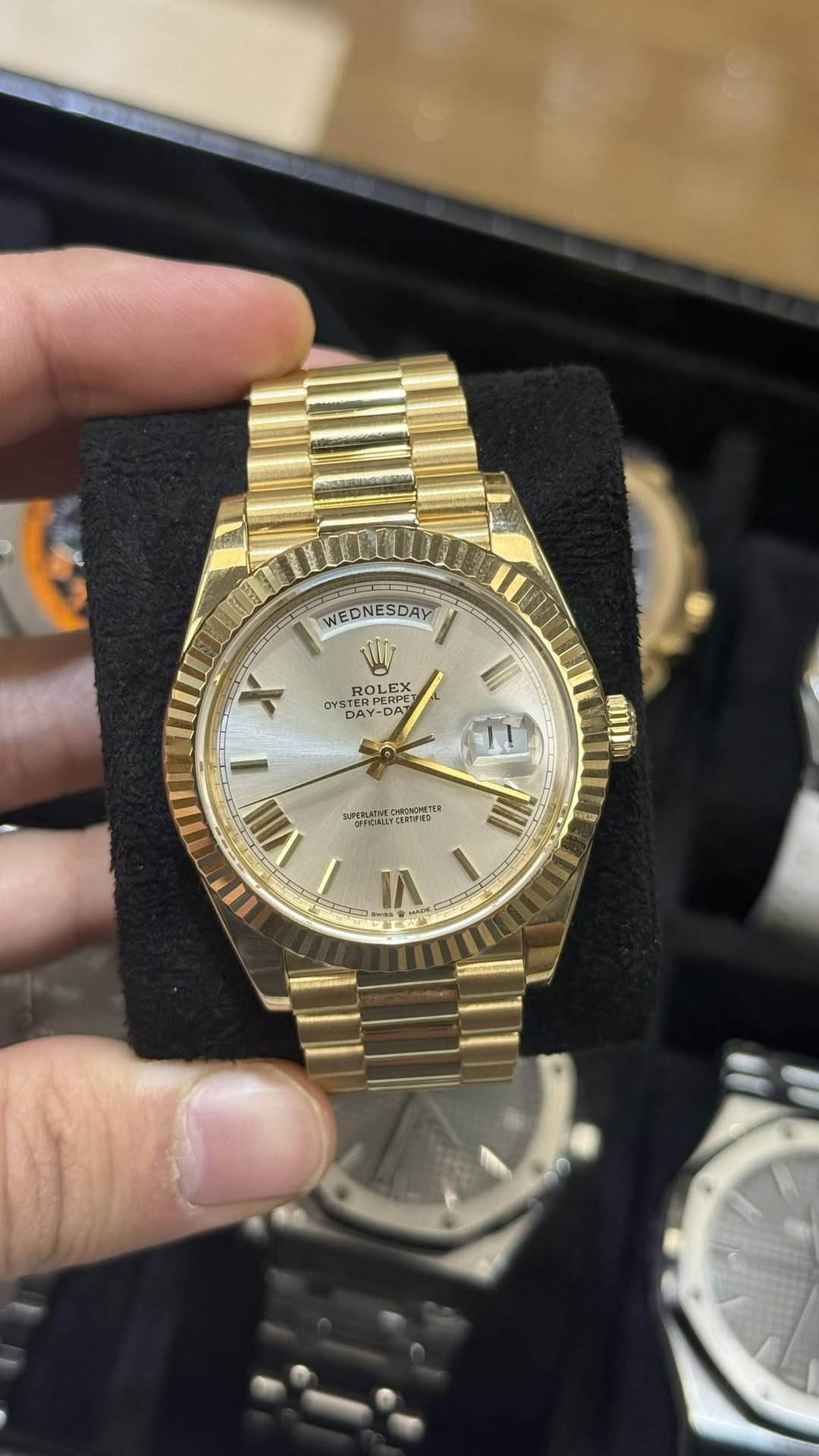 May be an image of wrist watch and text