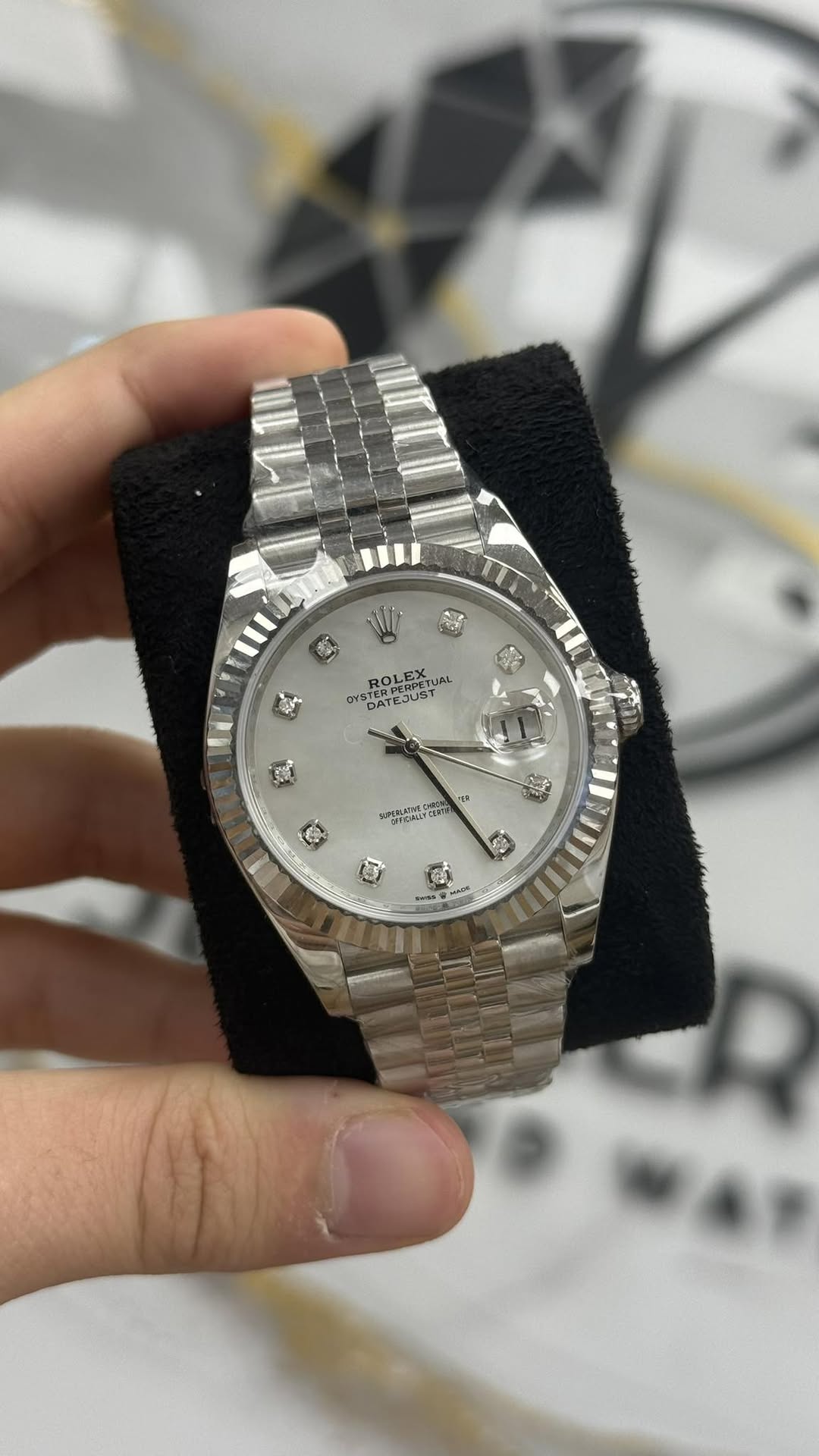 May be an image of wrist watch and text