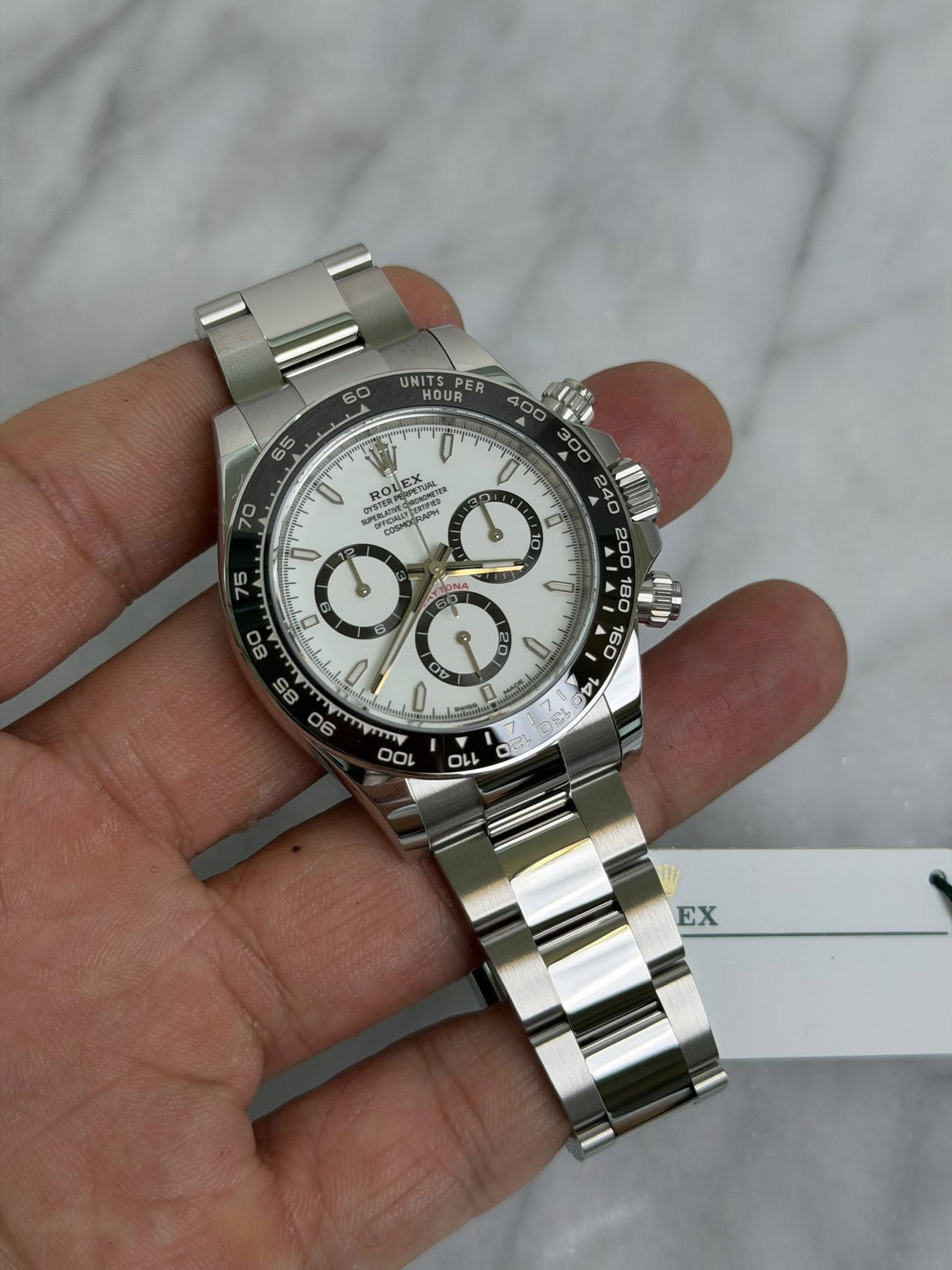 May be an image of wrist watch and text