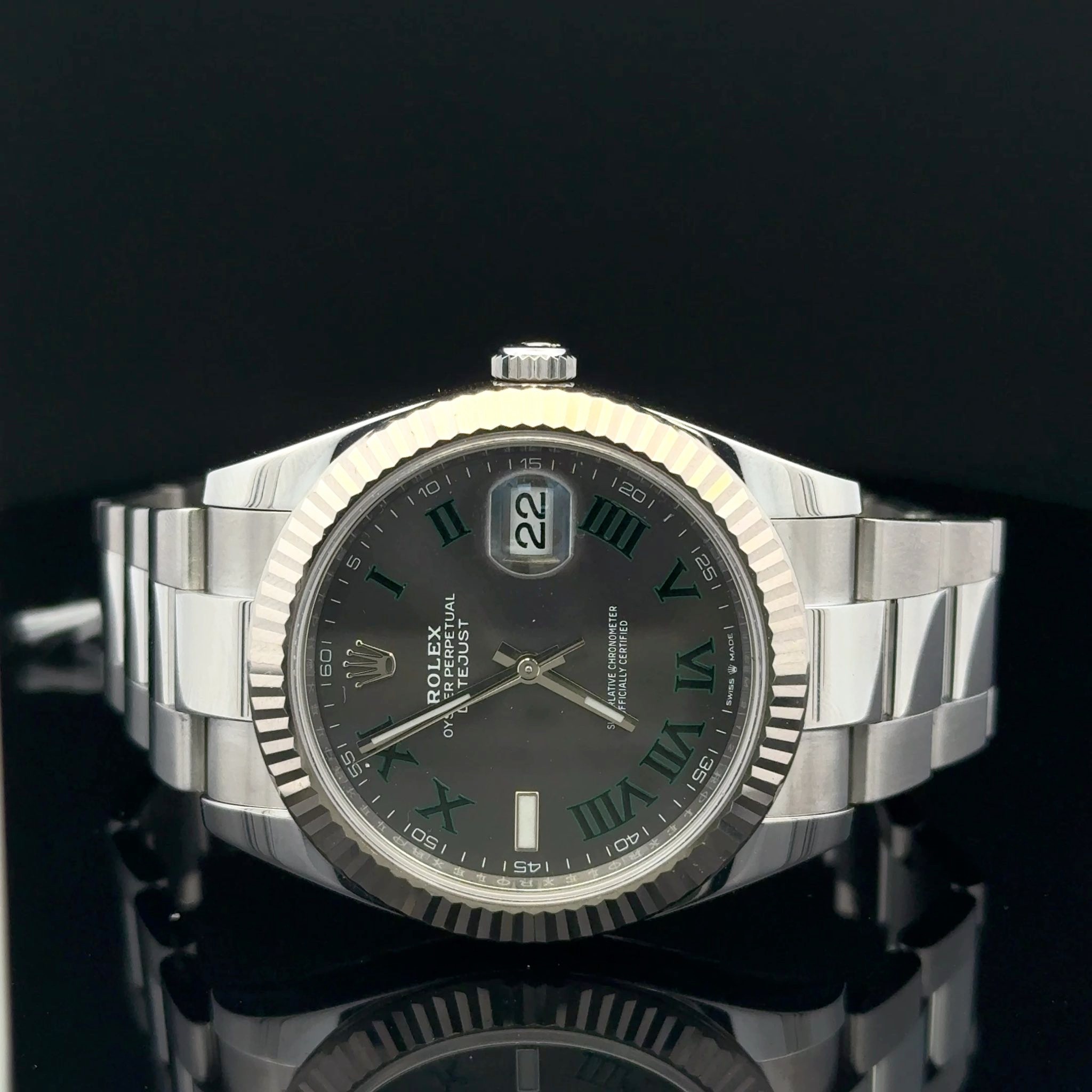 May be an image of wrist watch and text that says '50/ 22 60 UAL 20 ROLET ΕΣ TEJUST TIFIED CERITFED 55 O 05 35 AT SDi 00 6'