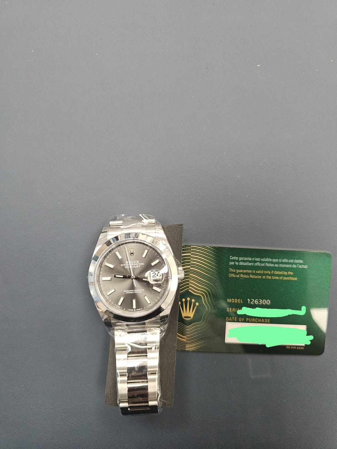 May be an image of wrist watch and text