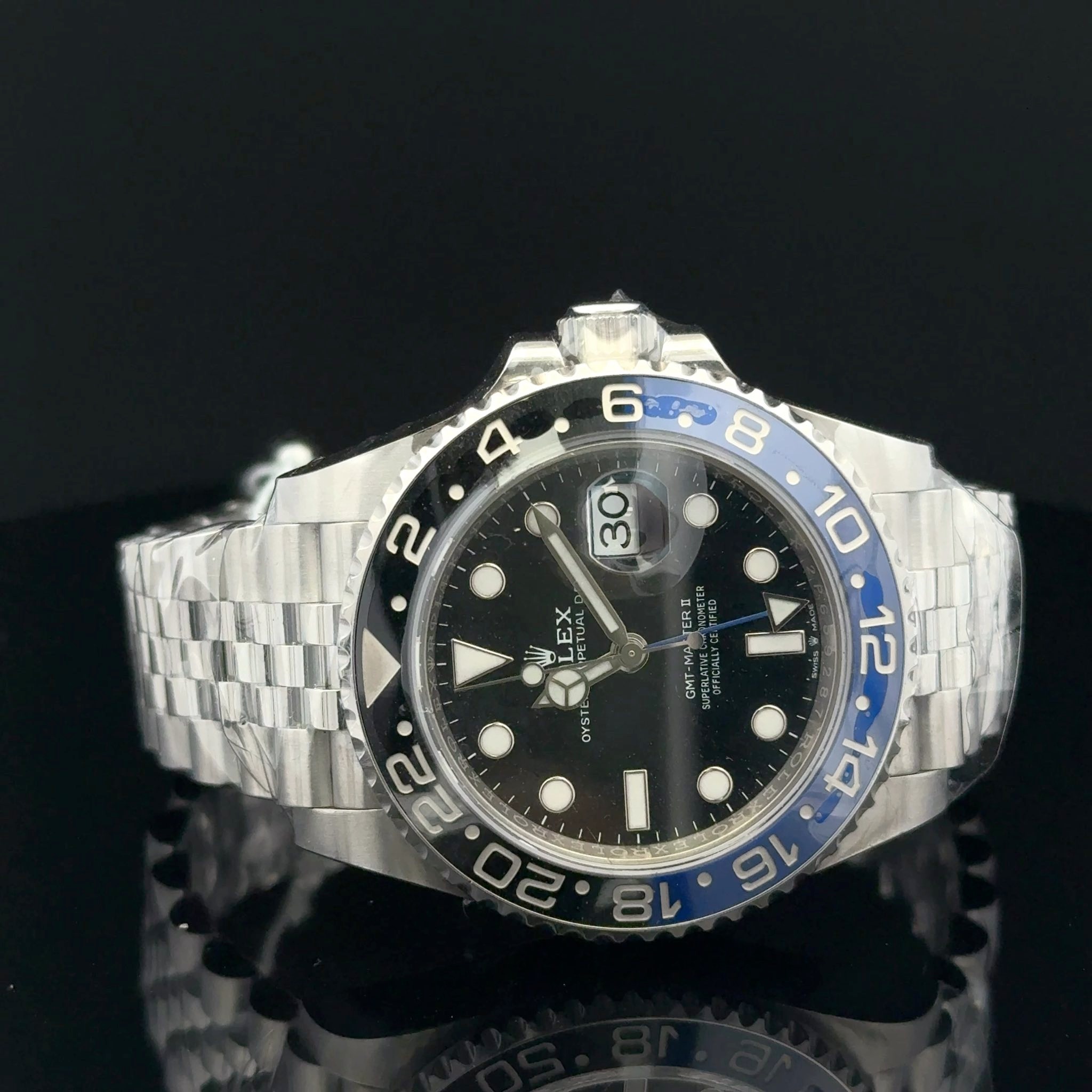 May be an image of wrist watch and text that says ' ل GMT-MALTER PLELLY PCIELLT TERI GMT TE ดร EX Sul L5A 5g OYSTE 12 22 S 14 16 18'