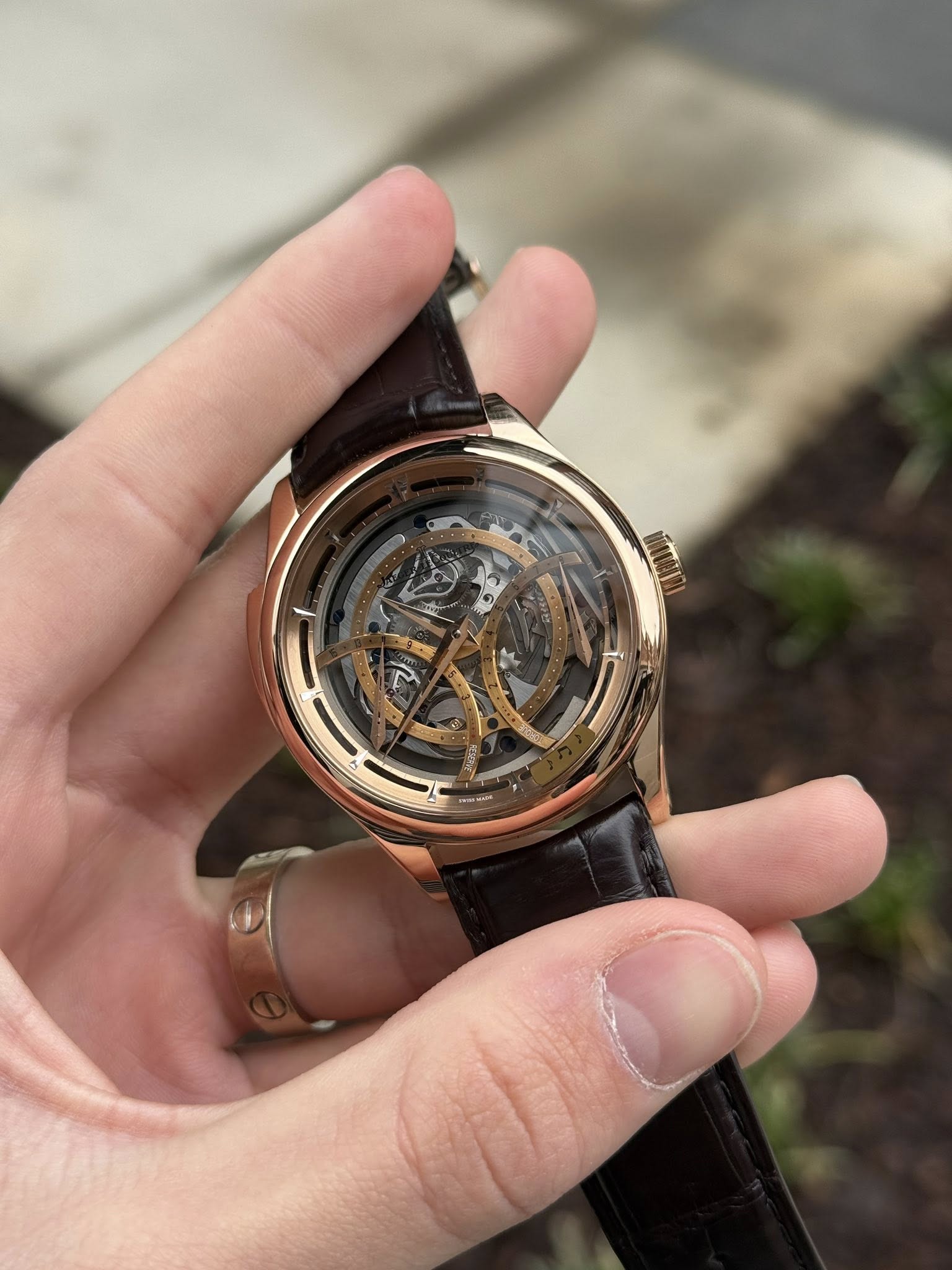 May be an image of wrist watch and text