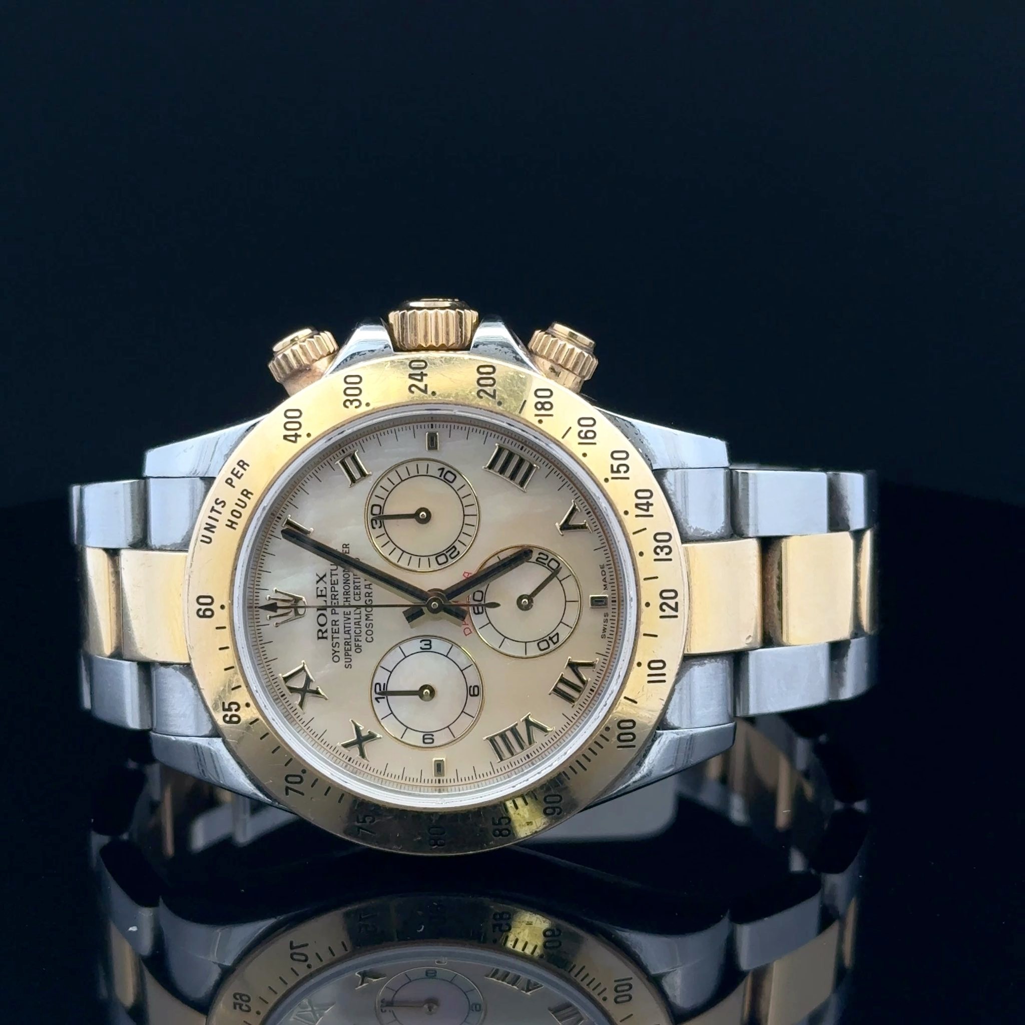 May be an image of wrist watch and text that says ' U JL PER UNITS HOUR ၁ 60 ψ TERP SUPEOFICIAK EX TIL C S 6 I VI VIIII 100 5 X 2'