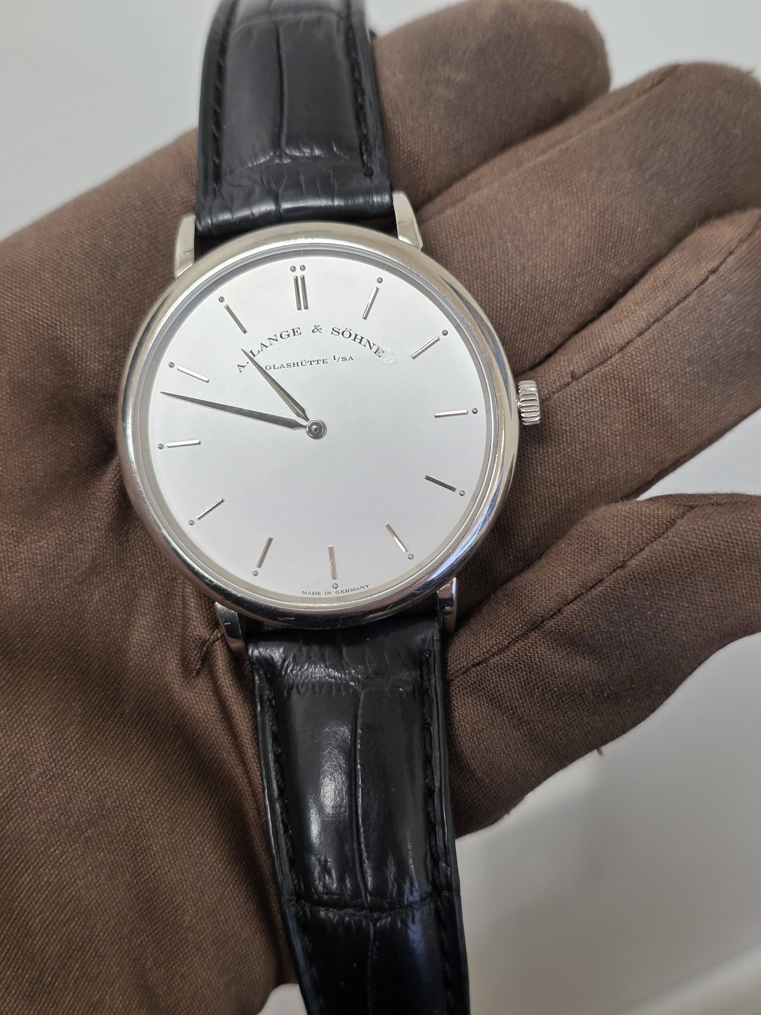 May be an image of wrist watch and text