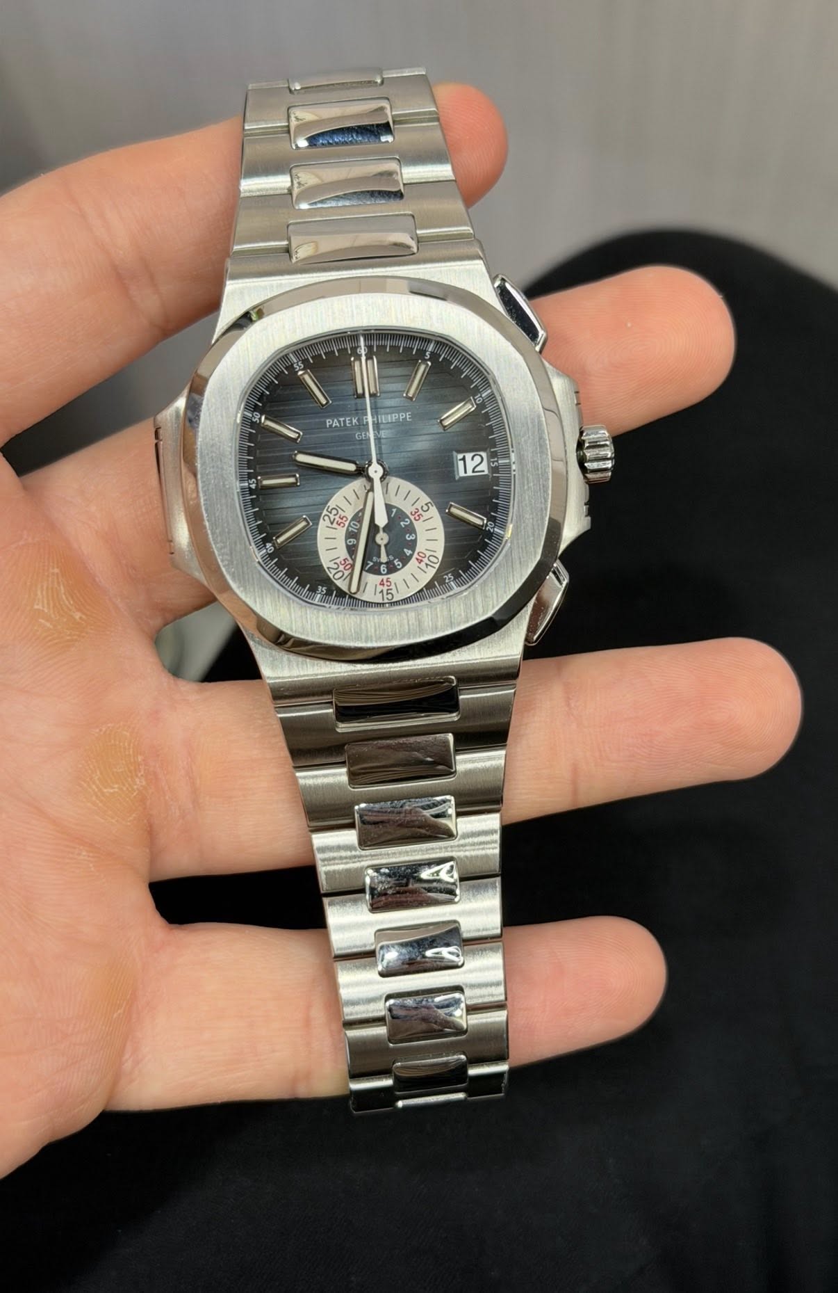 May be an image of wrist watch and text