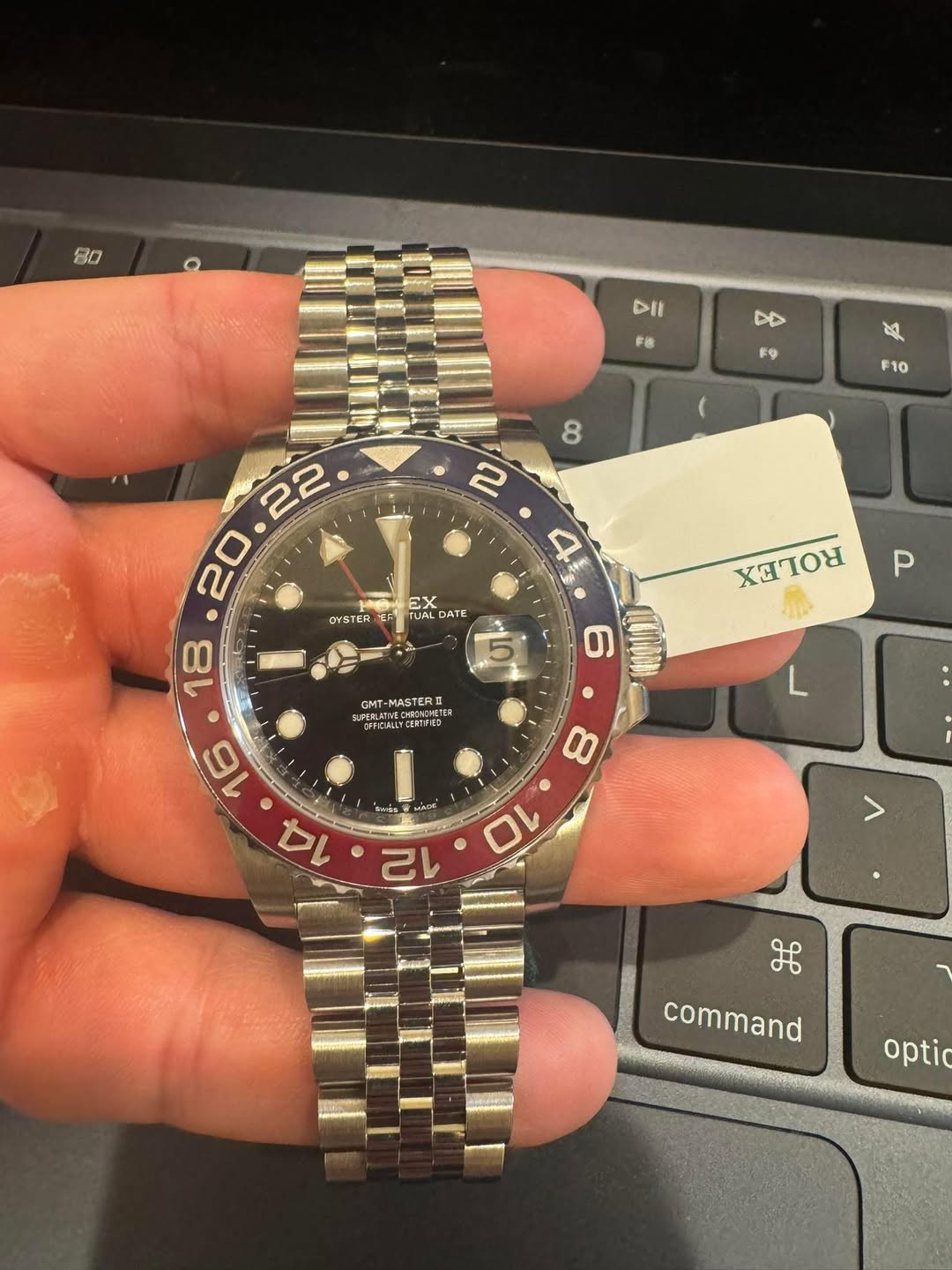 May be an image of wrist watch and text