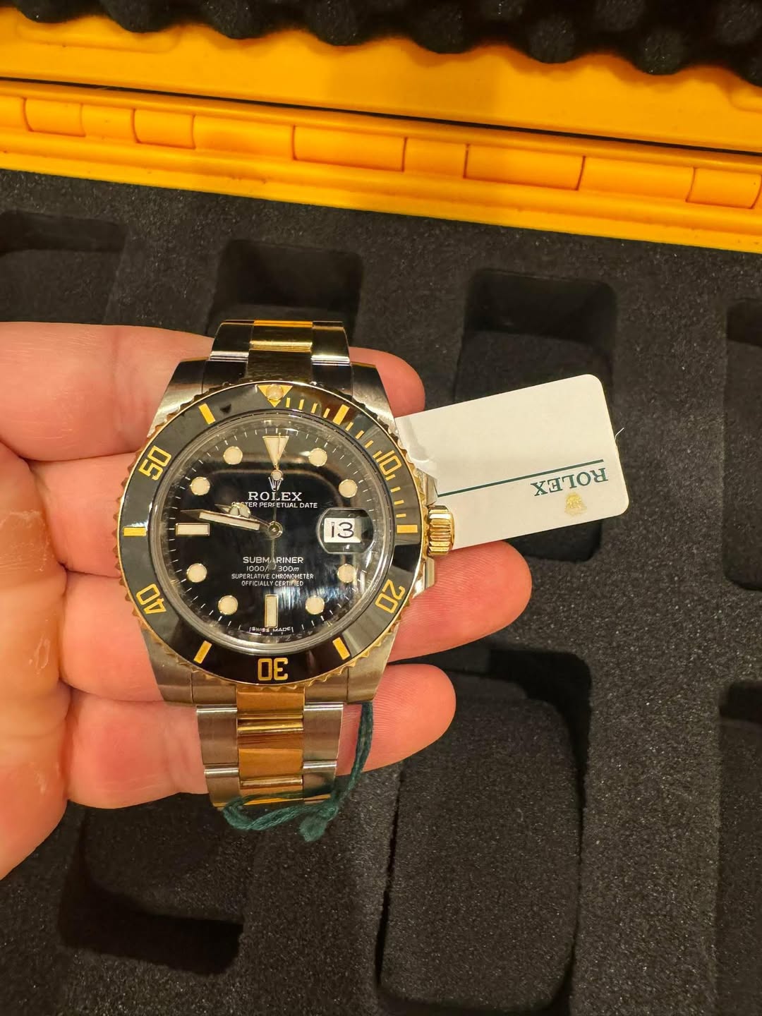 May be an image of wrist watch and text