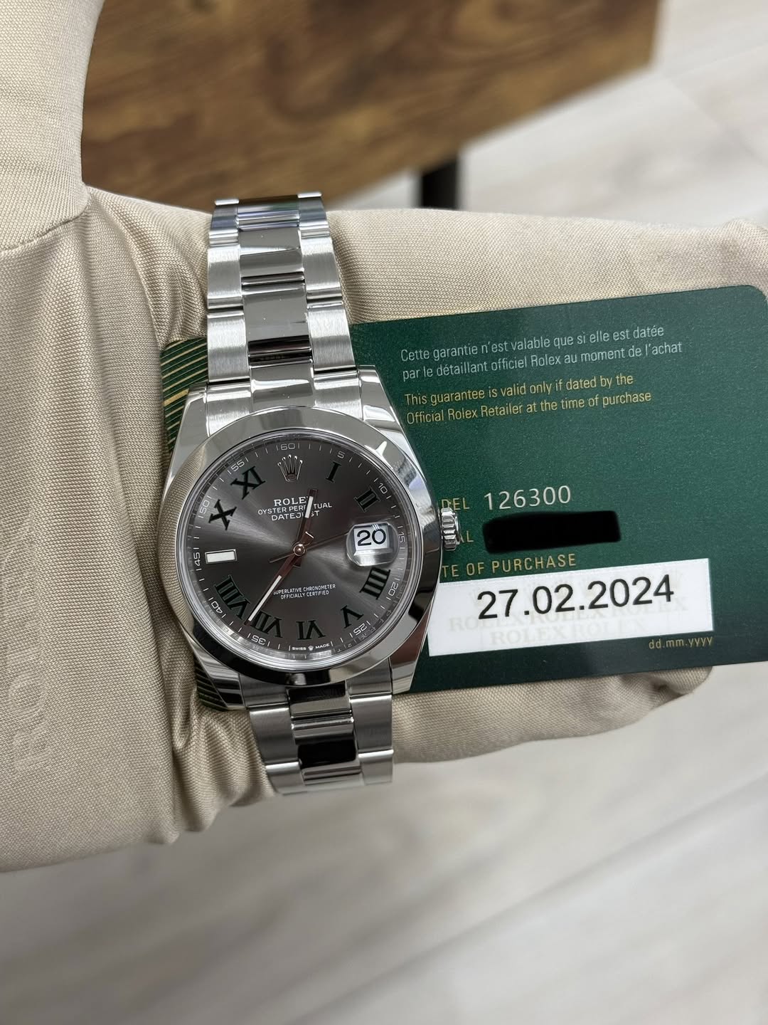 May be an image of wrist watch and text