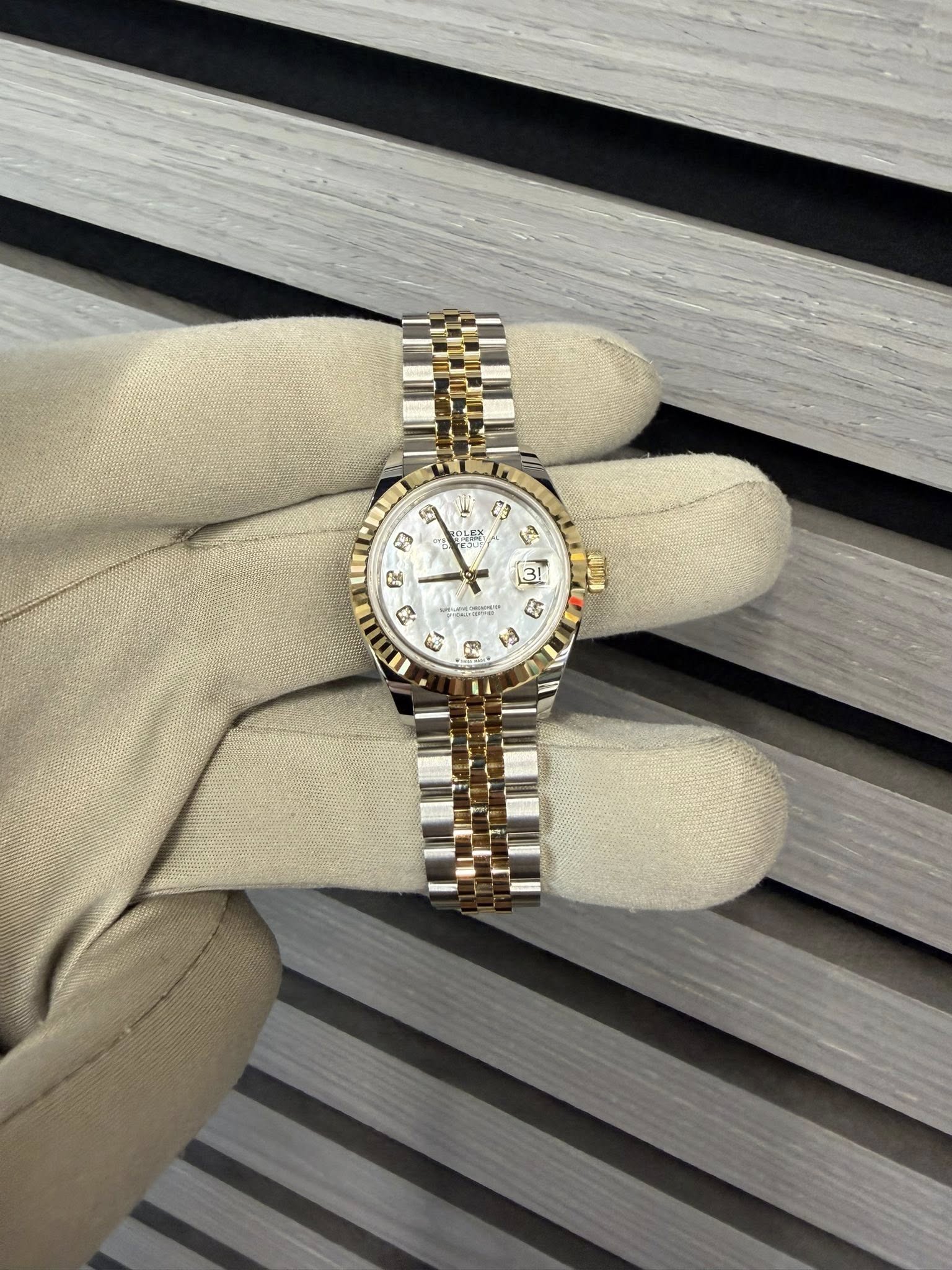 May be an image of wrist watch and text