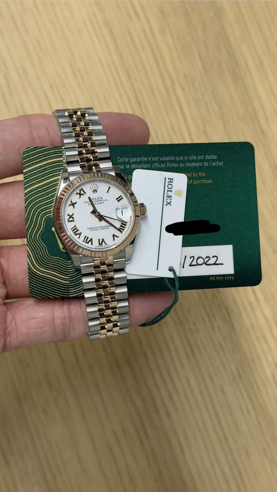 May be an image of wrist watch and text