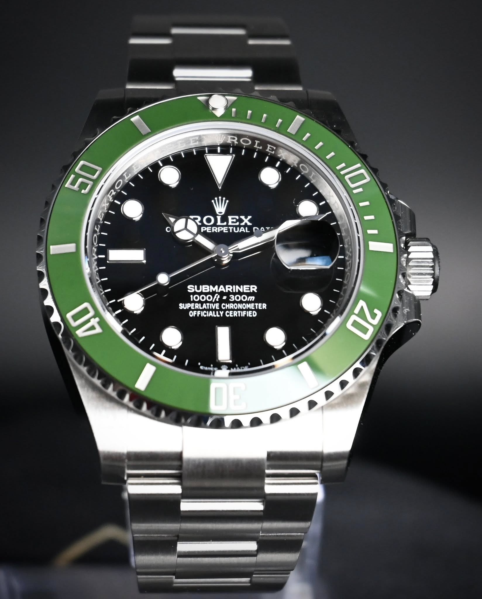 May be an image of wrist watch and text that says 'ROLE 50 R R ع C a ၀ 10 ROL OLEX PERPETUAI TUAL PERP PAT PO SUBMARINER 1000ft 300m SUPERLATIVE CHRONOMET NOMET TER OFFICIALLY…