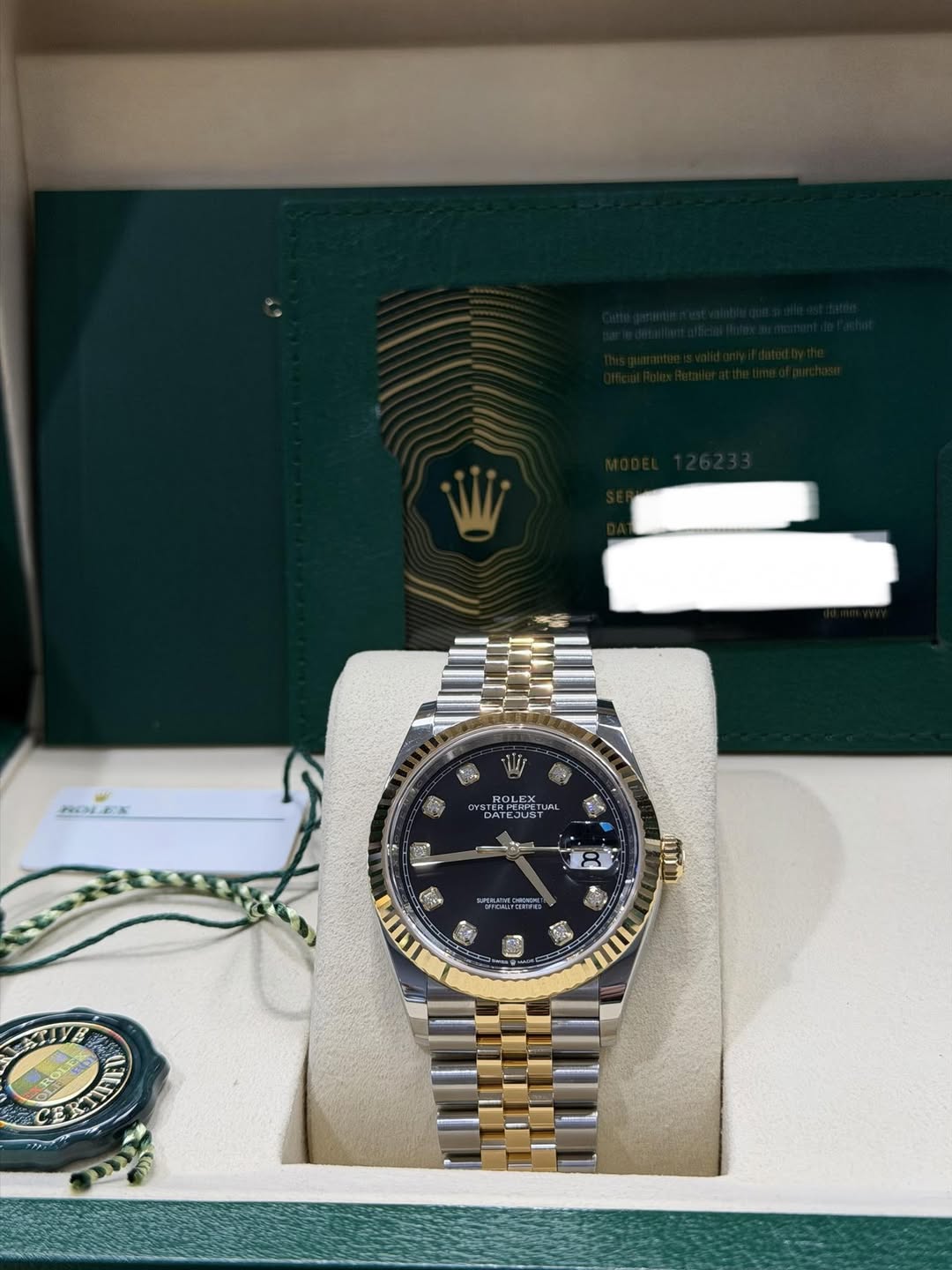 May be an image of wrist watch and text