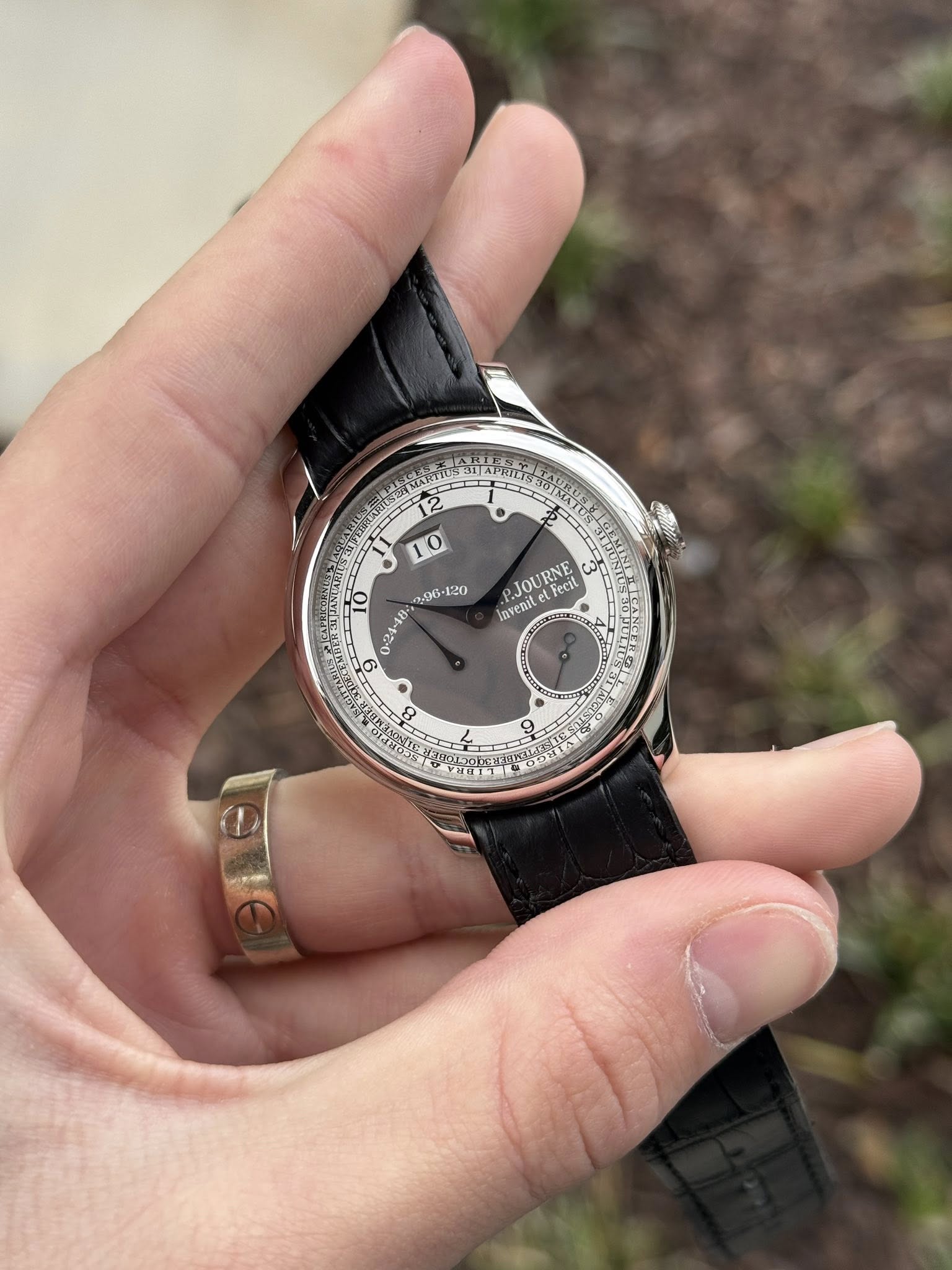 May be an image of wrist watch and text that says ' .9G PJOURNE eJot RNE ယ Fecit invenit D 8 HS5 9'
