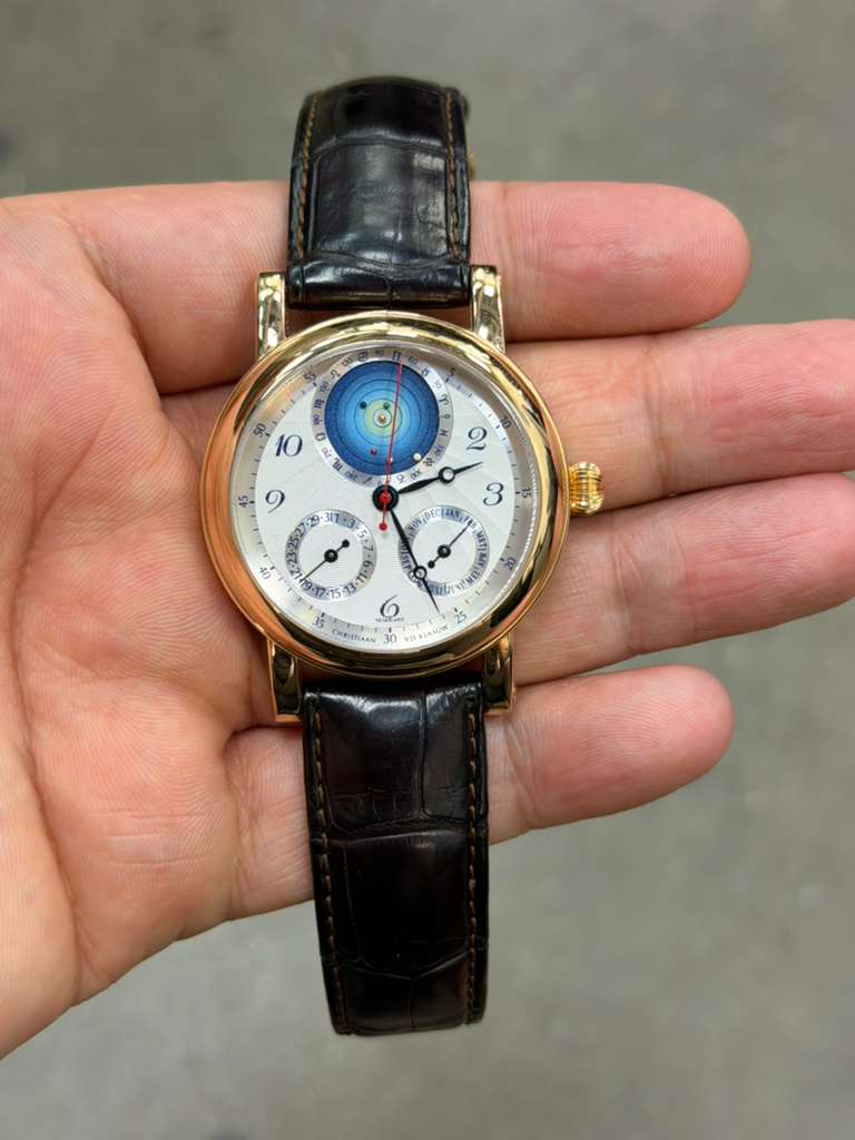 May be an image of wrist watch and text