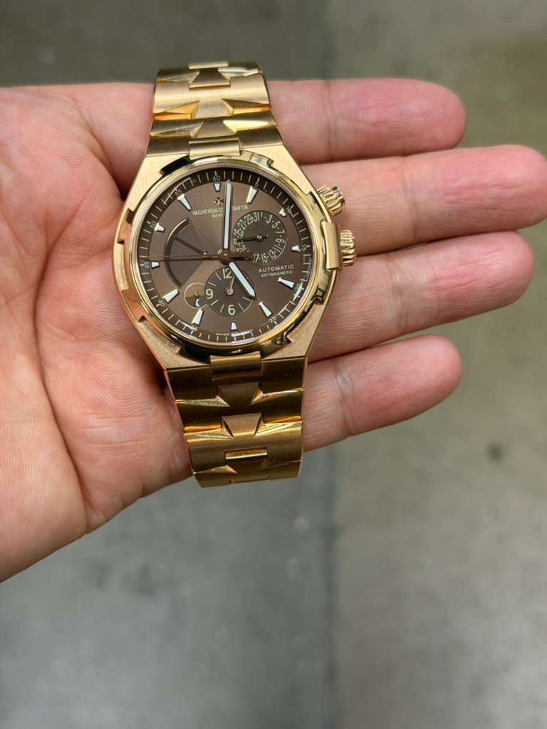 May be an image of wrist watch and text