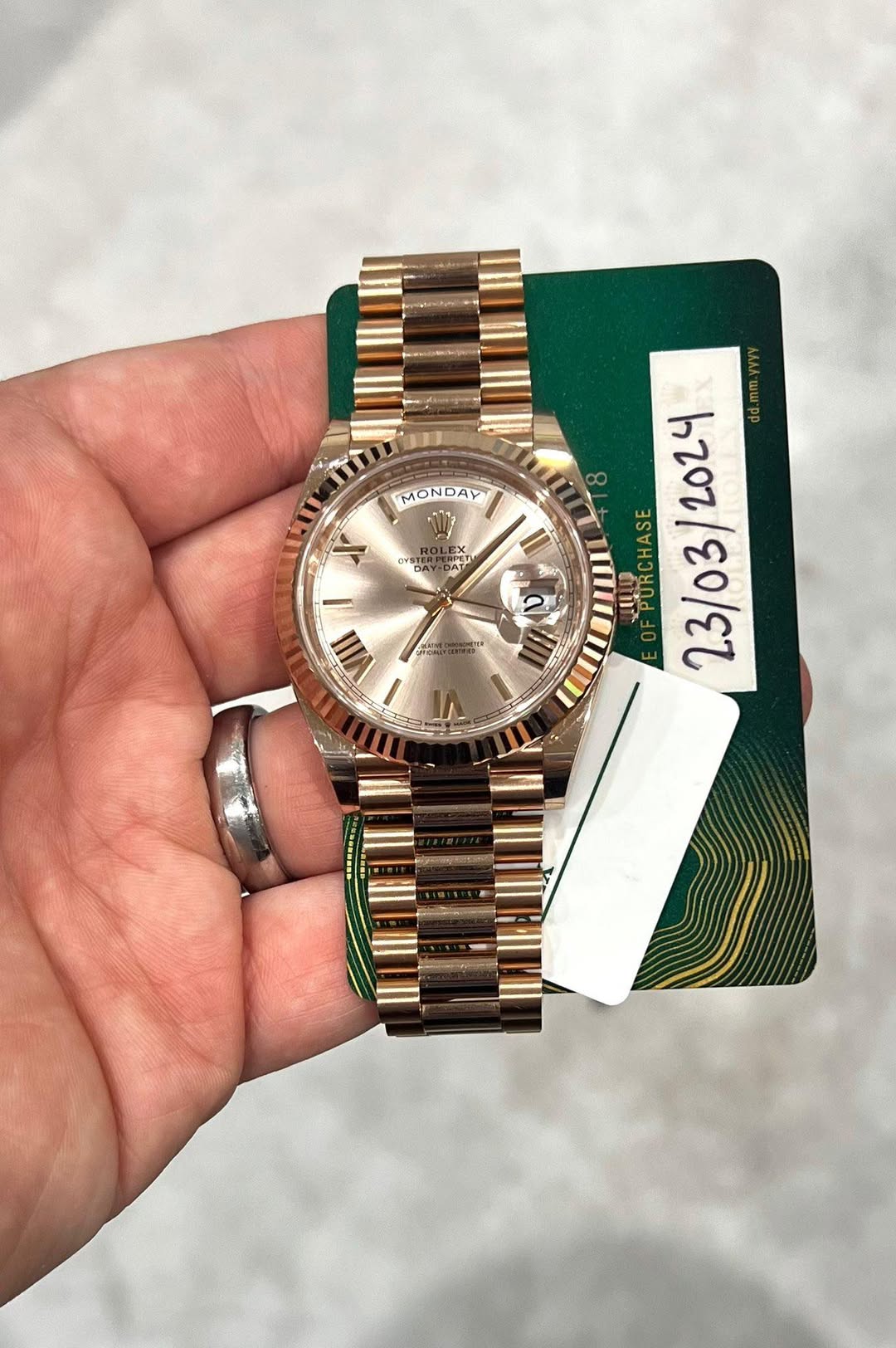 May be an image of wrist watch and text