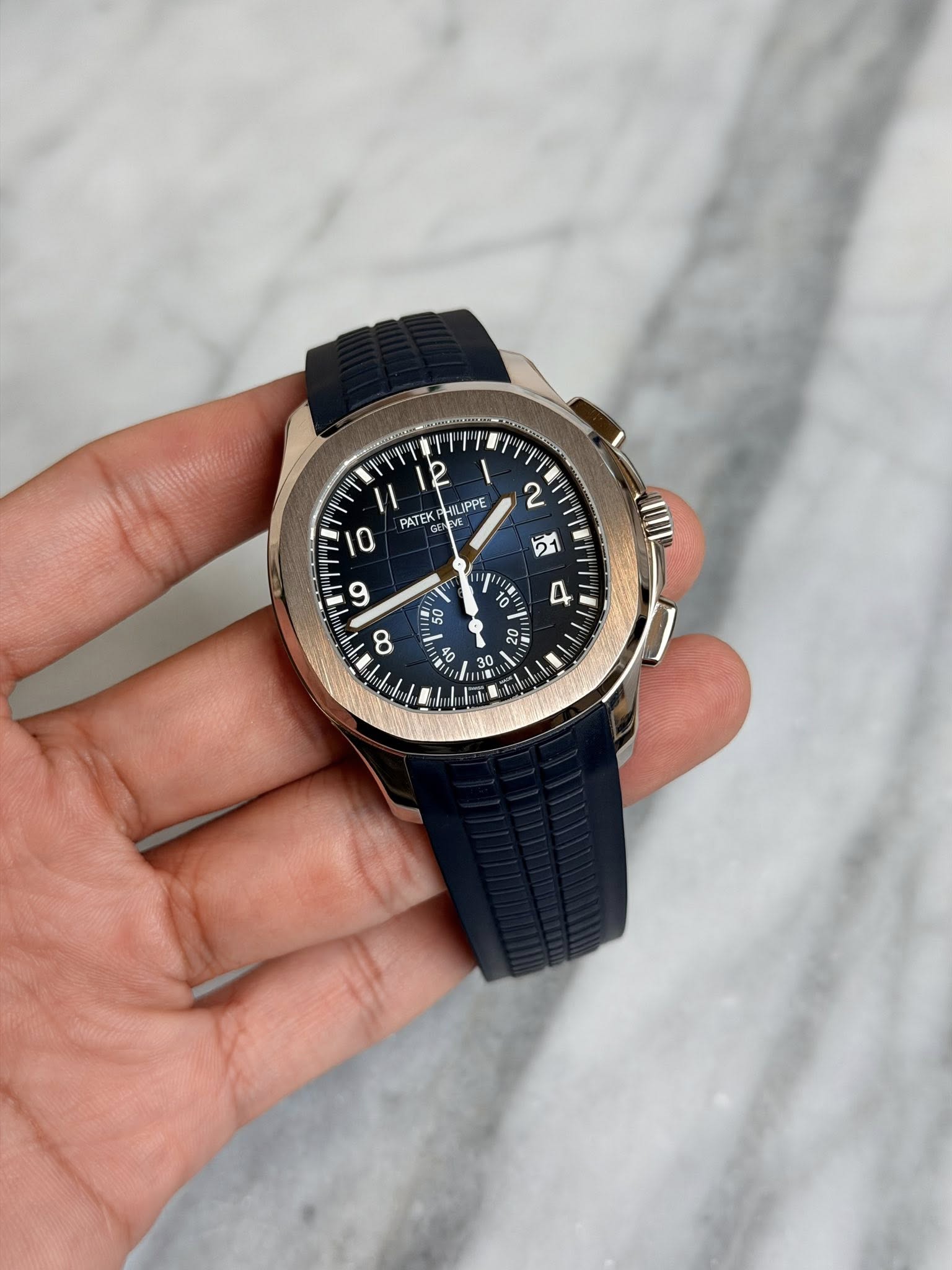 May be an image of wrist watch and text that says '2 PATEK N M IPPE " 0 T ١ 50 5 D 8 - ស I ب H US'