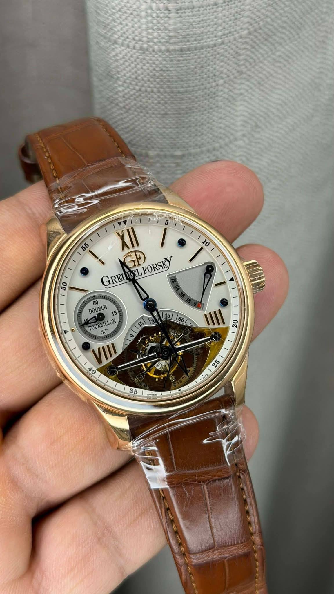 May be an image of wrist watch and text that says ' XII GRE GRELEELFORSE L GD FORSEY 50 I 60 DOUBLE 5 5 TOURBILLON 145160/ IIII 20 O8 OE 5 ហ 35 Mt'