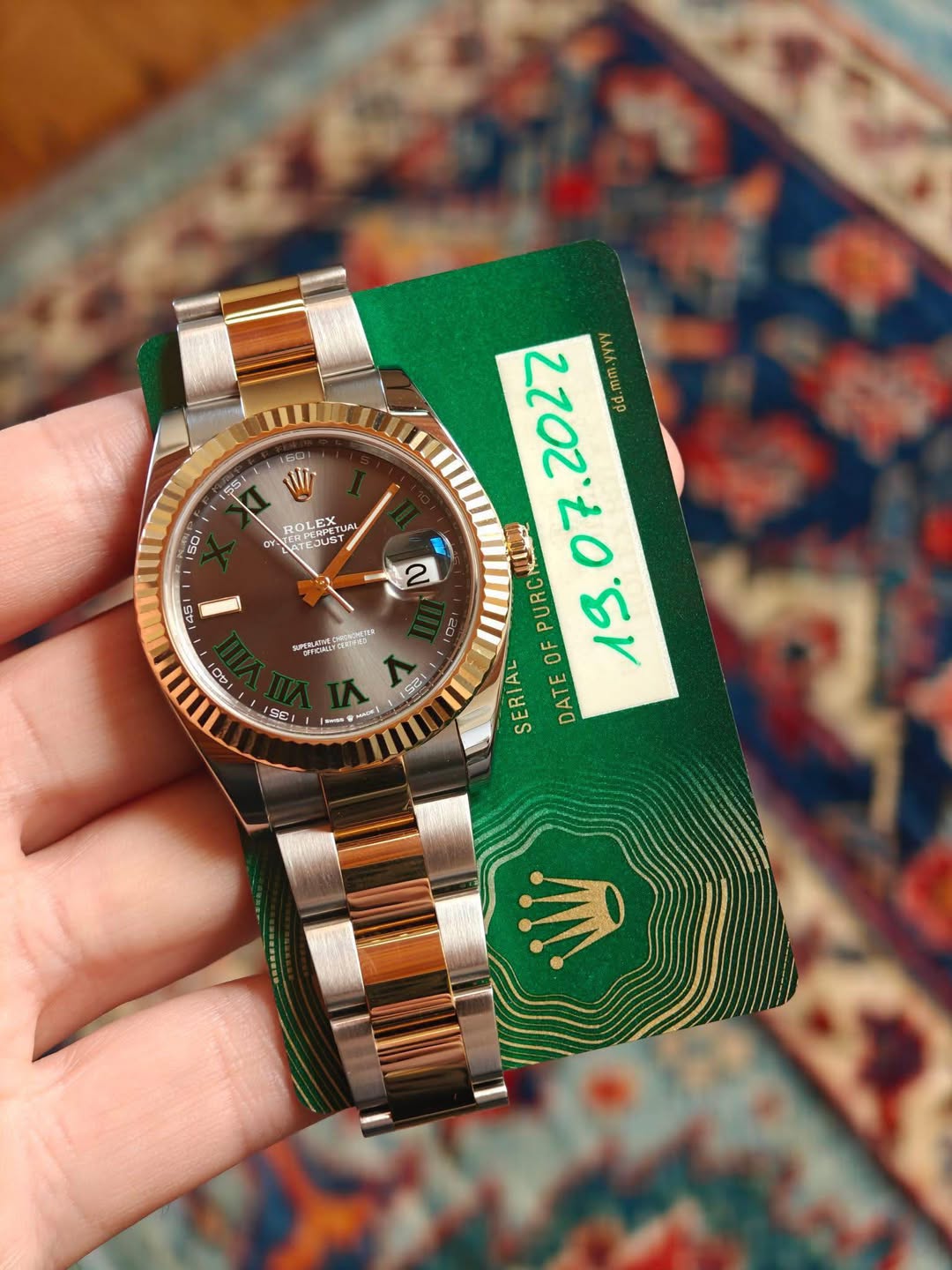 May be an image of wrist watch and text