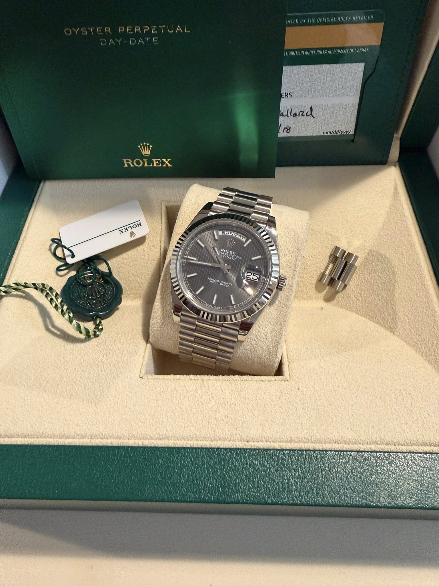 May be an image of wrist watch and text