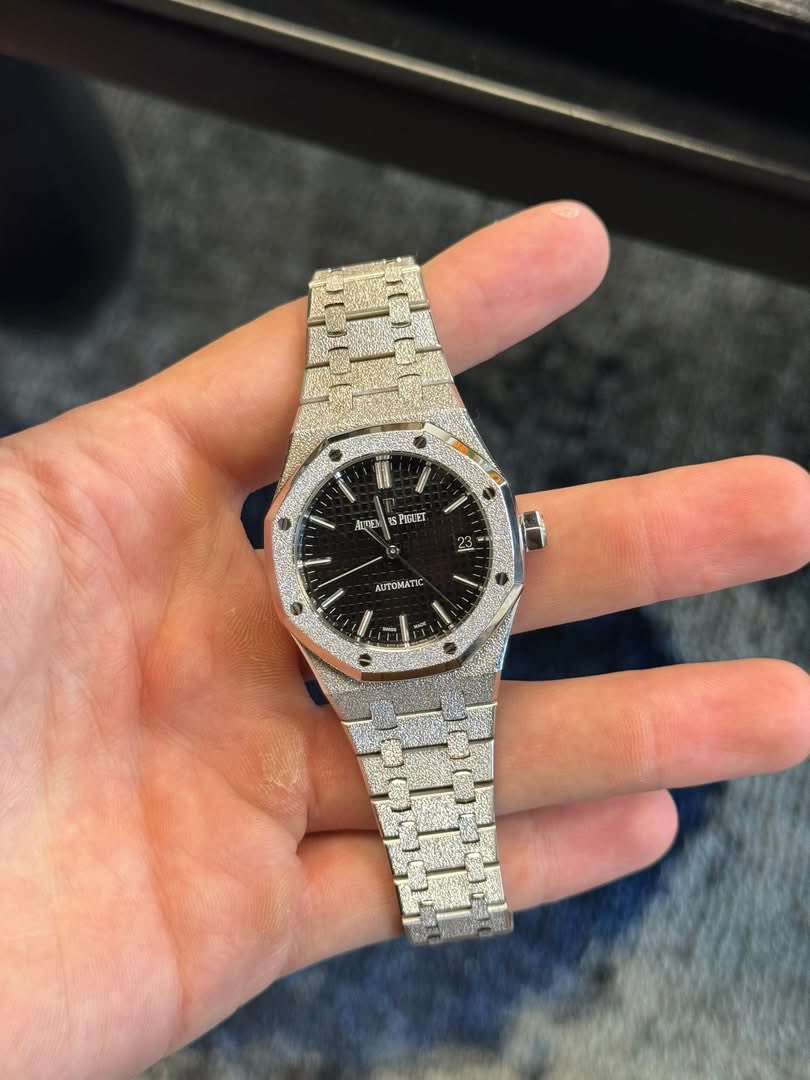 May be an image of wrist watch and text