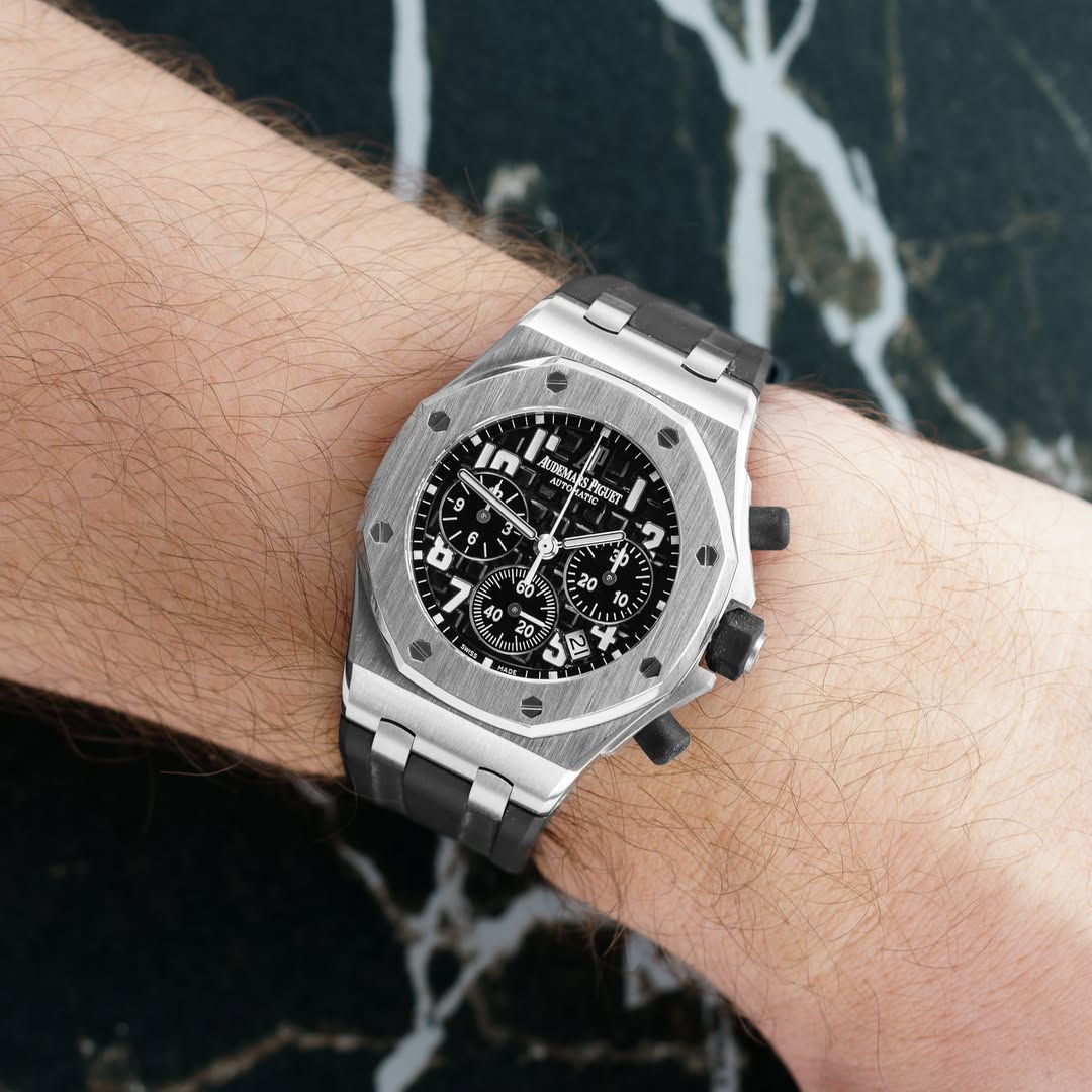 May be an image of wrist watch and text