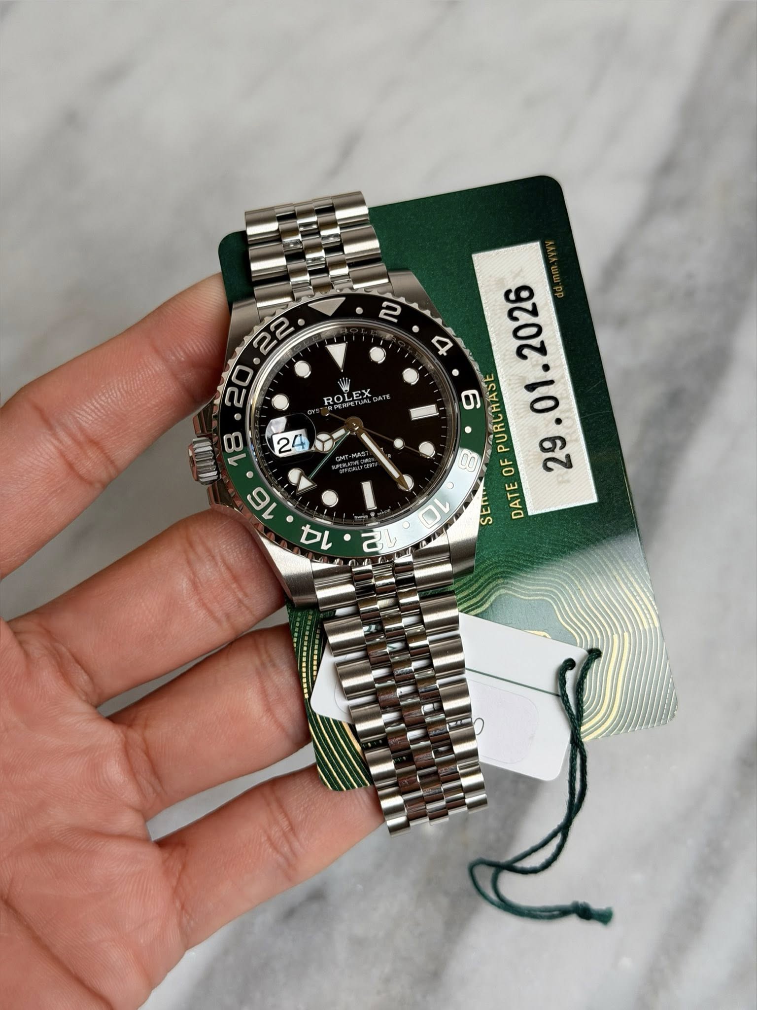 May be an image of wrist watch and text that says ' ROLEX 18 24 16 ים b PURCRASE OF SElm DATE वा'