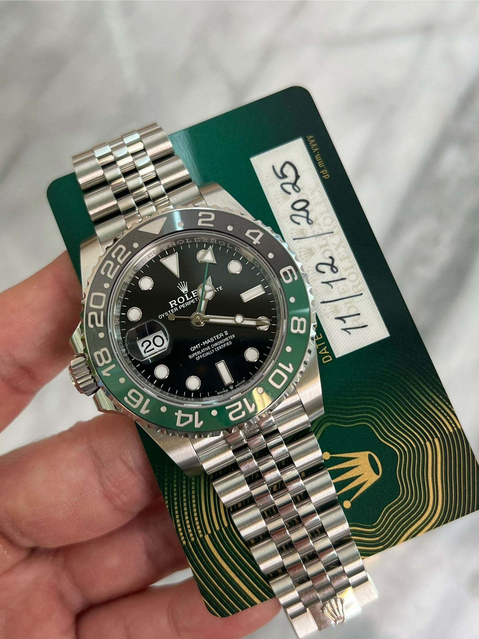 May be an image of wrist watch and text