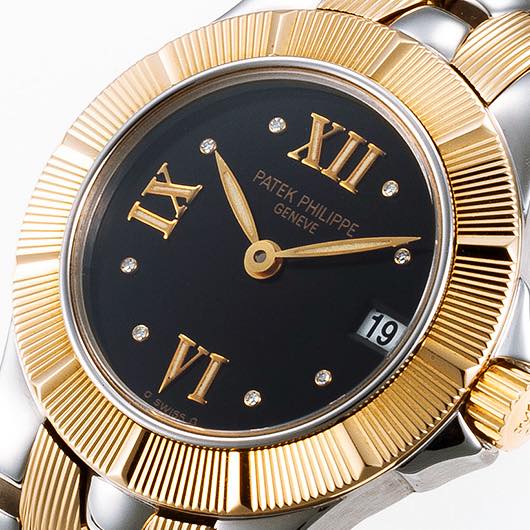 May be an image of wrist watch and text that says 'XII G IX 19 9 VI'