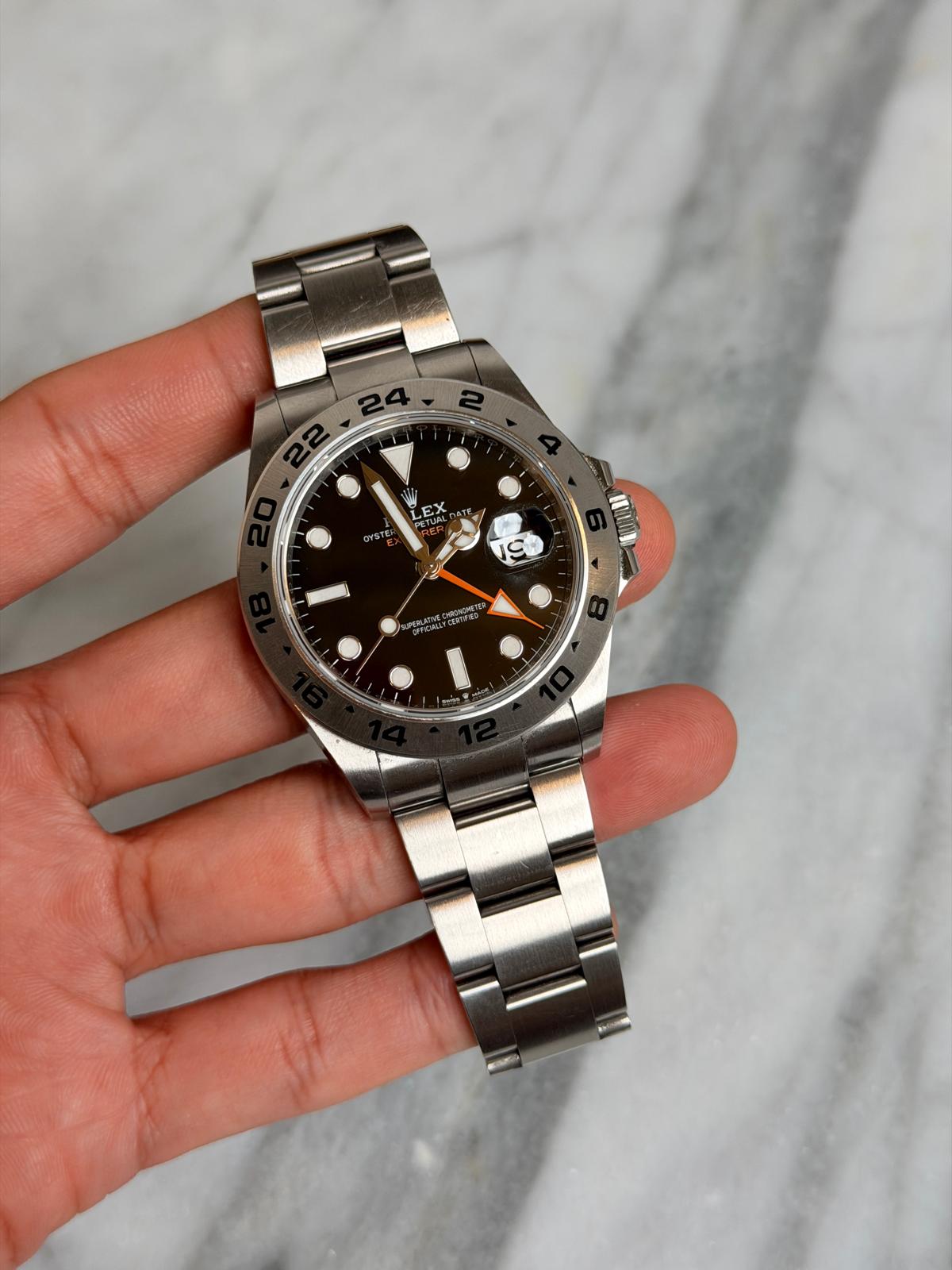 May be an image of wrist watch and text