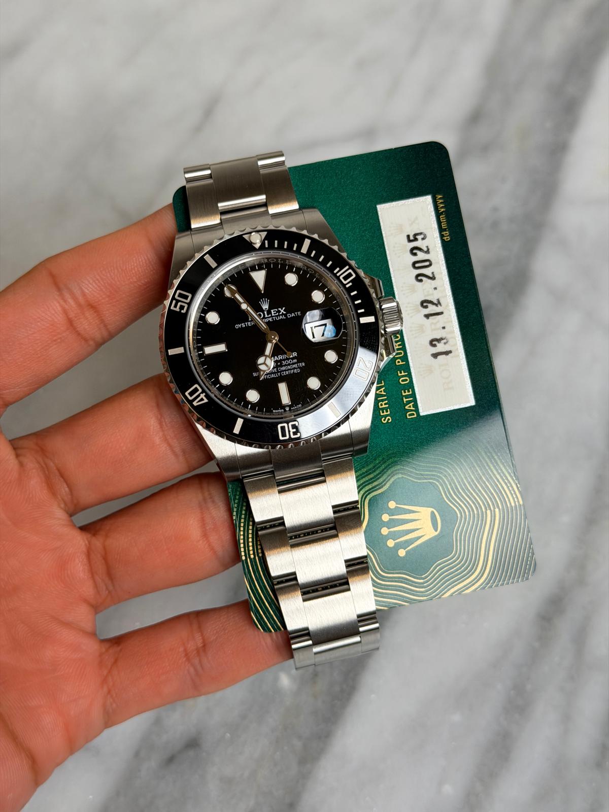 May be an image of wrist watch and text that says 'I 50 LEX E OYSTE 7 40 미' 2025 的通 Οκτ OF SERIAL ATEOFPURC RO DATE D0'