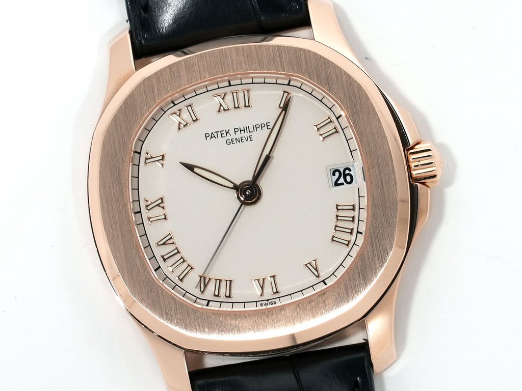 May be an image of wrist watch and text that says 'XI XII PATEK ATEKPHILIPPE PHILIPPE GENEVE AЛ WAIL 26 IIII V IX E TILA VII VI SWISS'