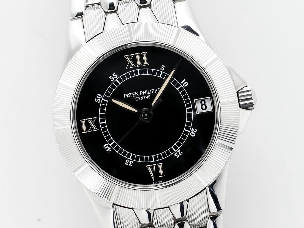 May be an image of wrist watch and text that says '5 XII 55 PATEK GENEVE PHILIPP PATEKPHILIPP IPP 50 10 ထ IX VILI G VI SWISS'