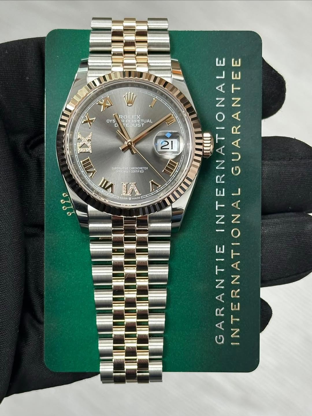 May be an image of wrist watch and text that says 'W ROLE OYS ETUAL D EJUST X VIII SUPTELATME SPTELTAECIRONONET IRONOMETER VII اه 220 21 0 INTERNATIONALE ATIONALGUARANTEE…