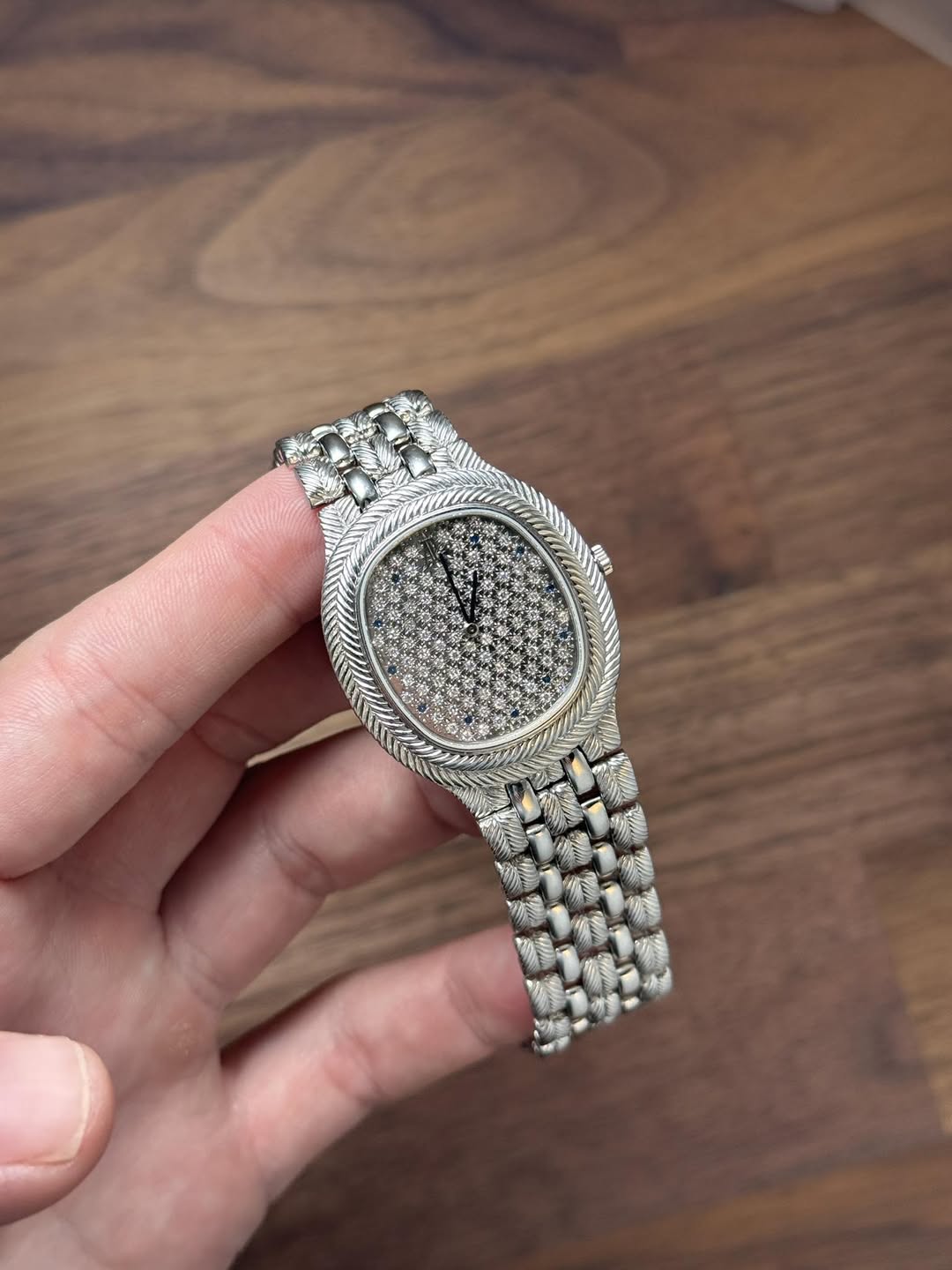 May be an image of wrist watch and text